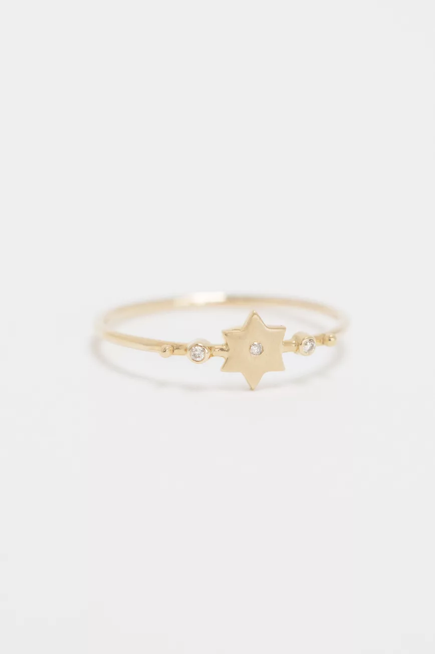Yellow gold ring sculpted north star motif diamond accent slim band Celine Daoust