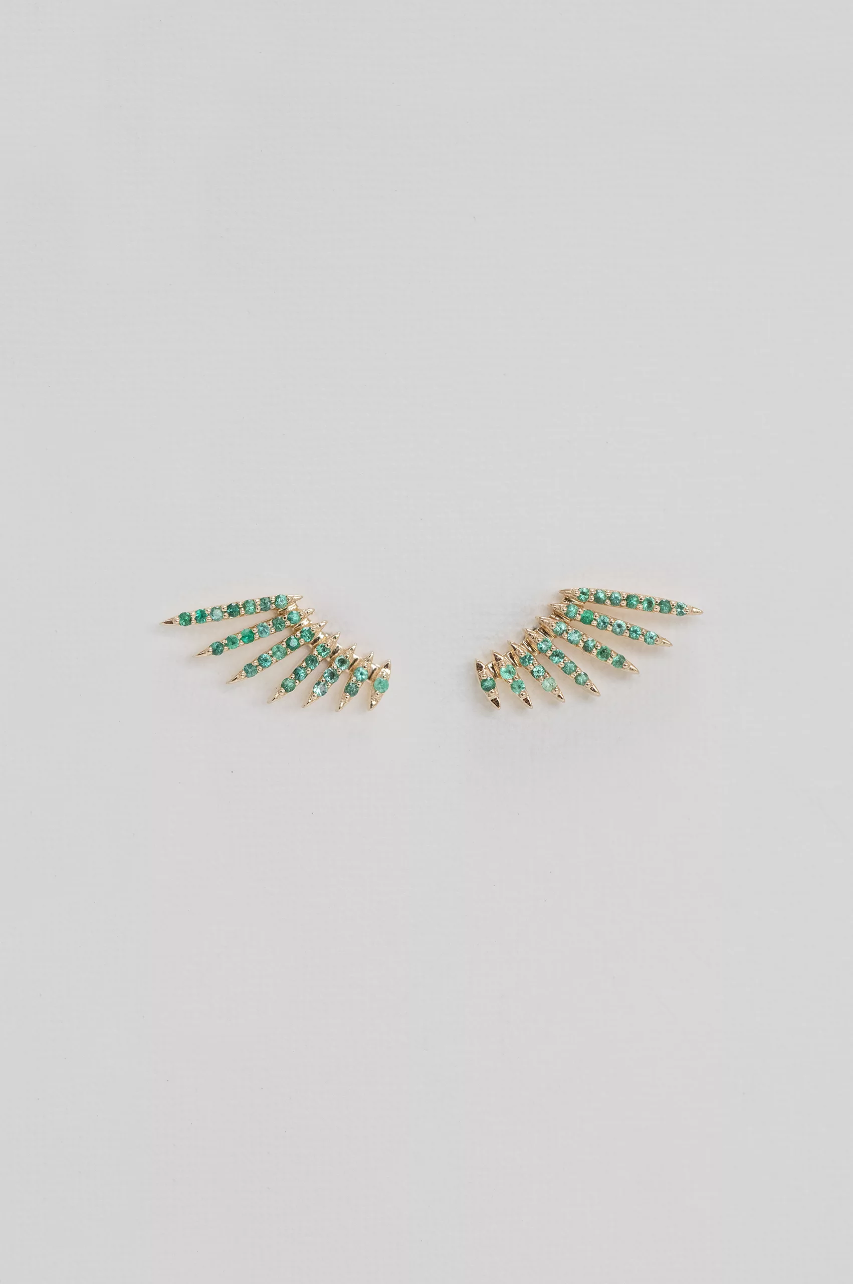 Yellow gold stud earrings sculpted wing motif pavé emerald pair Celine Daoust