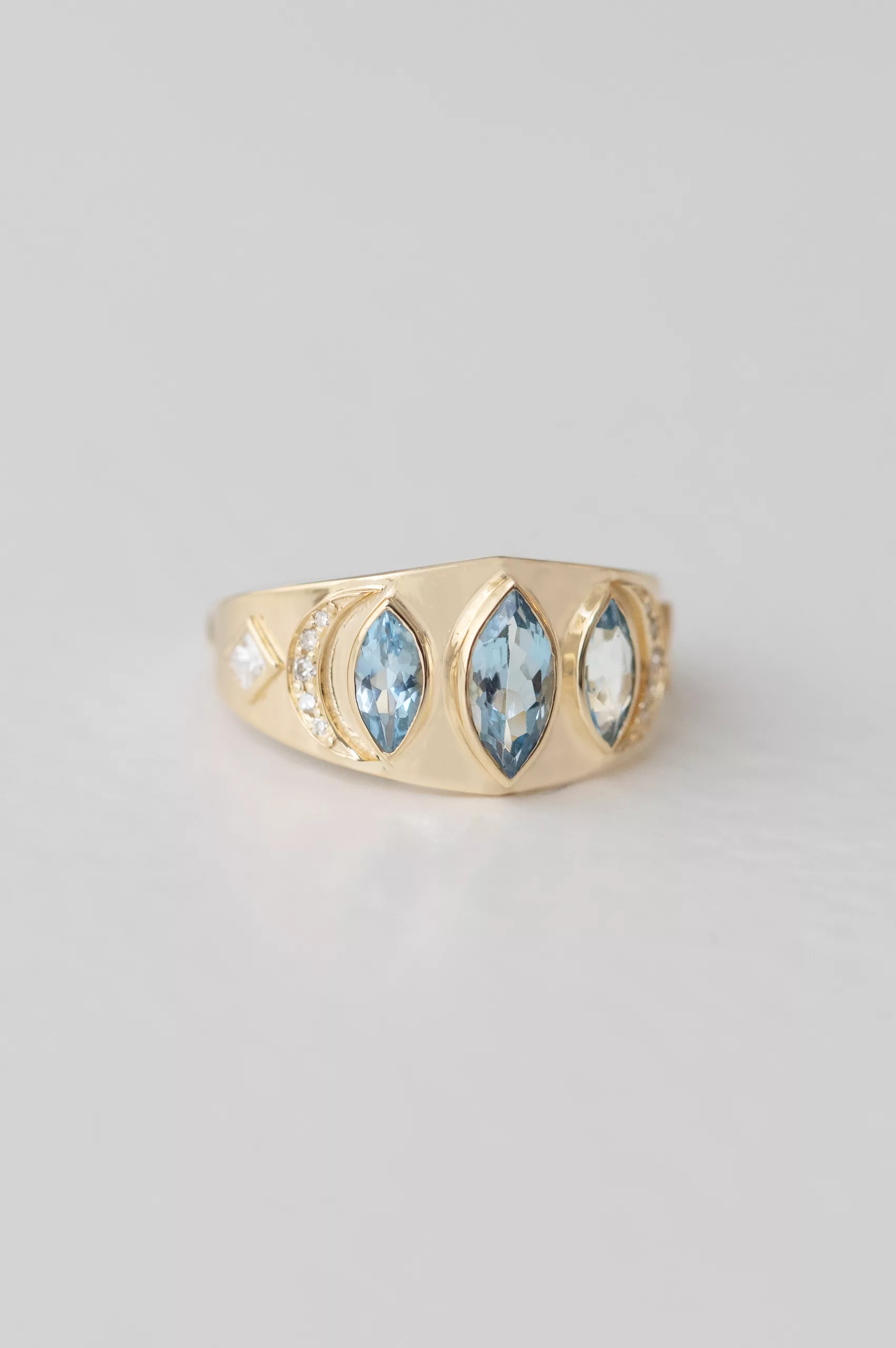 Yellow gold signet ring three marquise aquamarine diamond accent sides Celine Daoust