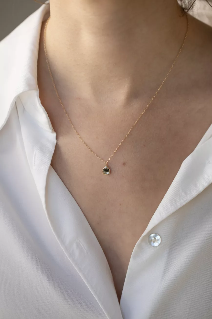 Yellow gold necklace freeform grey diamond slice bezel pendant worn on neck Celine Daoust