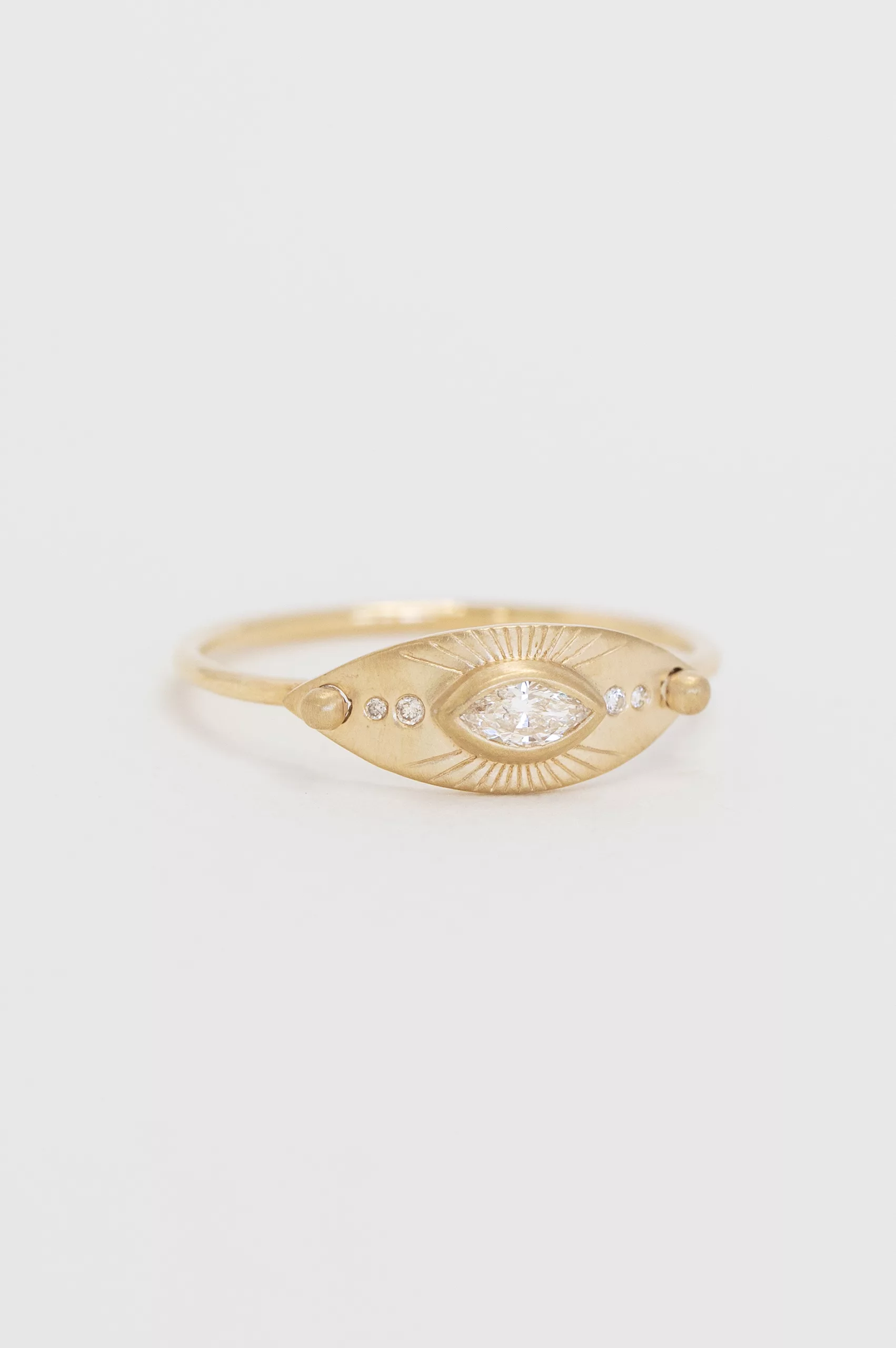 Gold ring large eye motif marquise diamond engraved sun rays Celine Daoust
