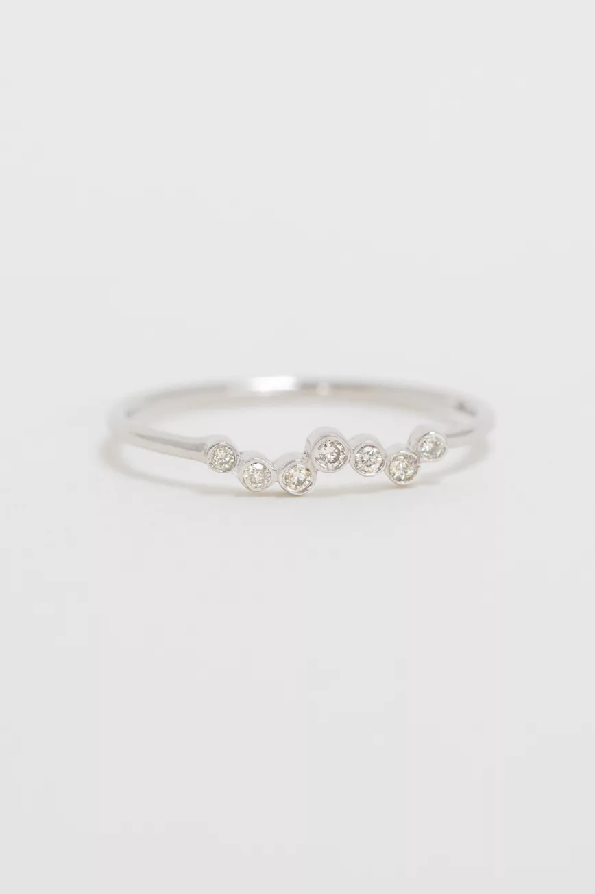 white gold ring with a twisted band design set with a continuous row of round brilliant diamonds along a delicate twisted wire