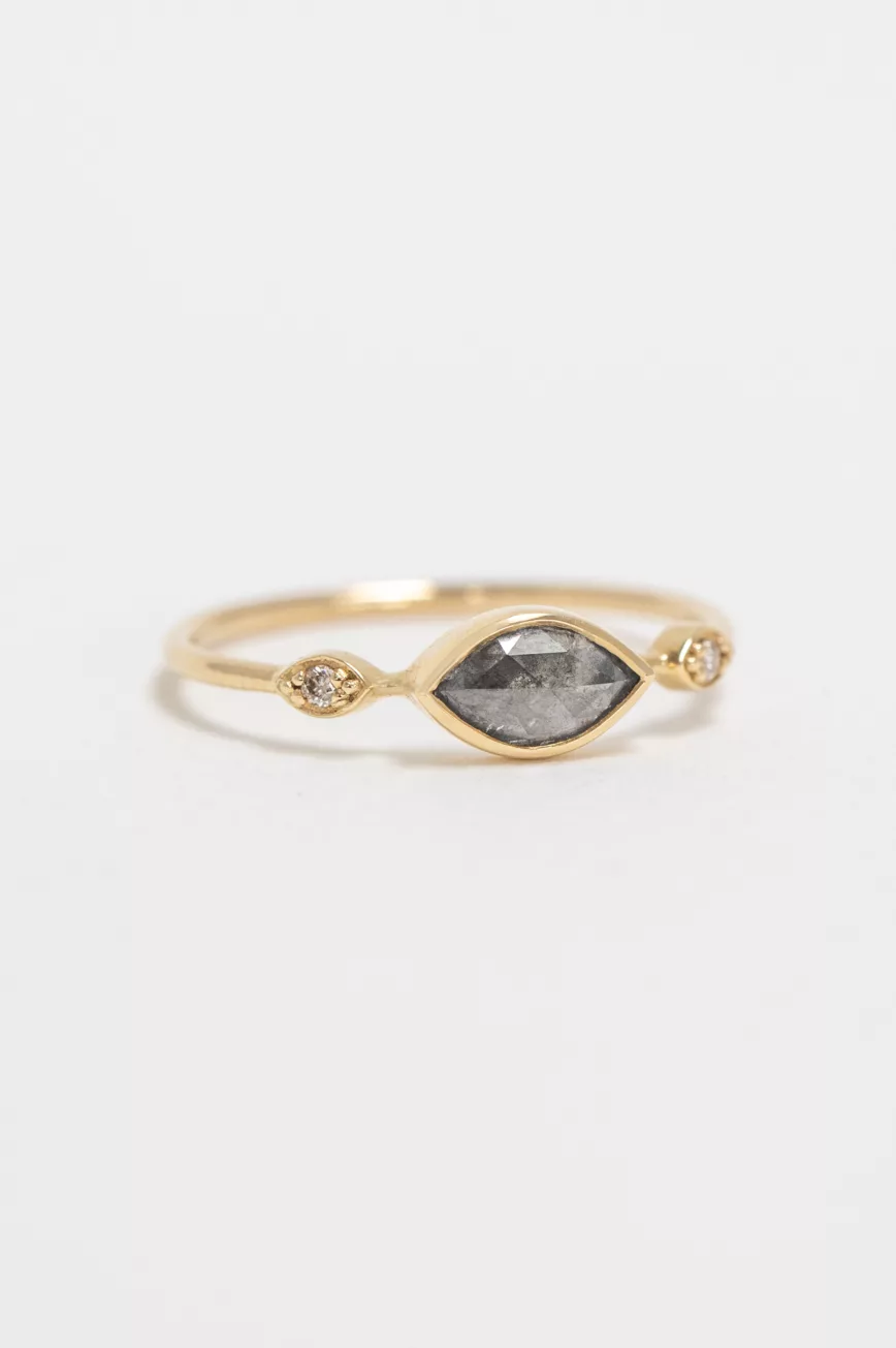Yellow gold ring oval grey diamond two diamond eye accent slim band worn on hand Celine Daoust