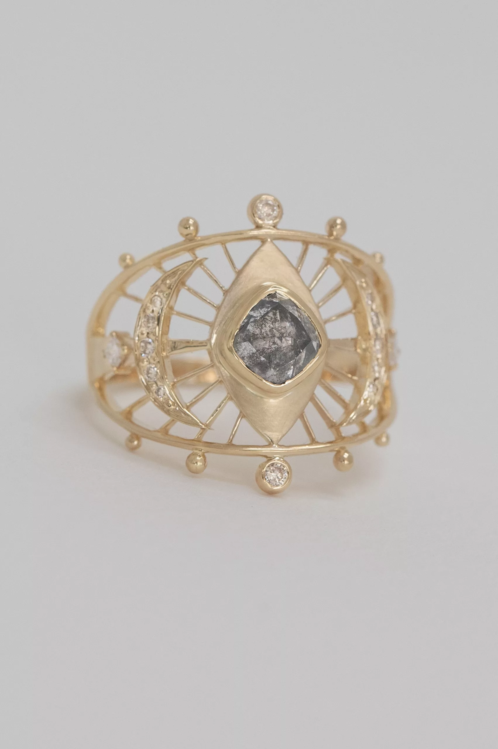 Gold wide ring grey diamond eye motif open geometric frame Celine Daoust