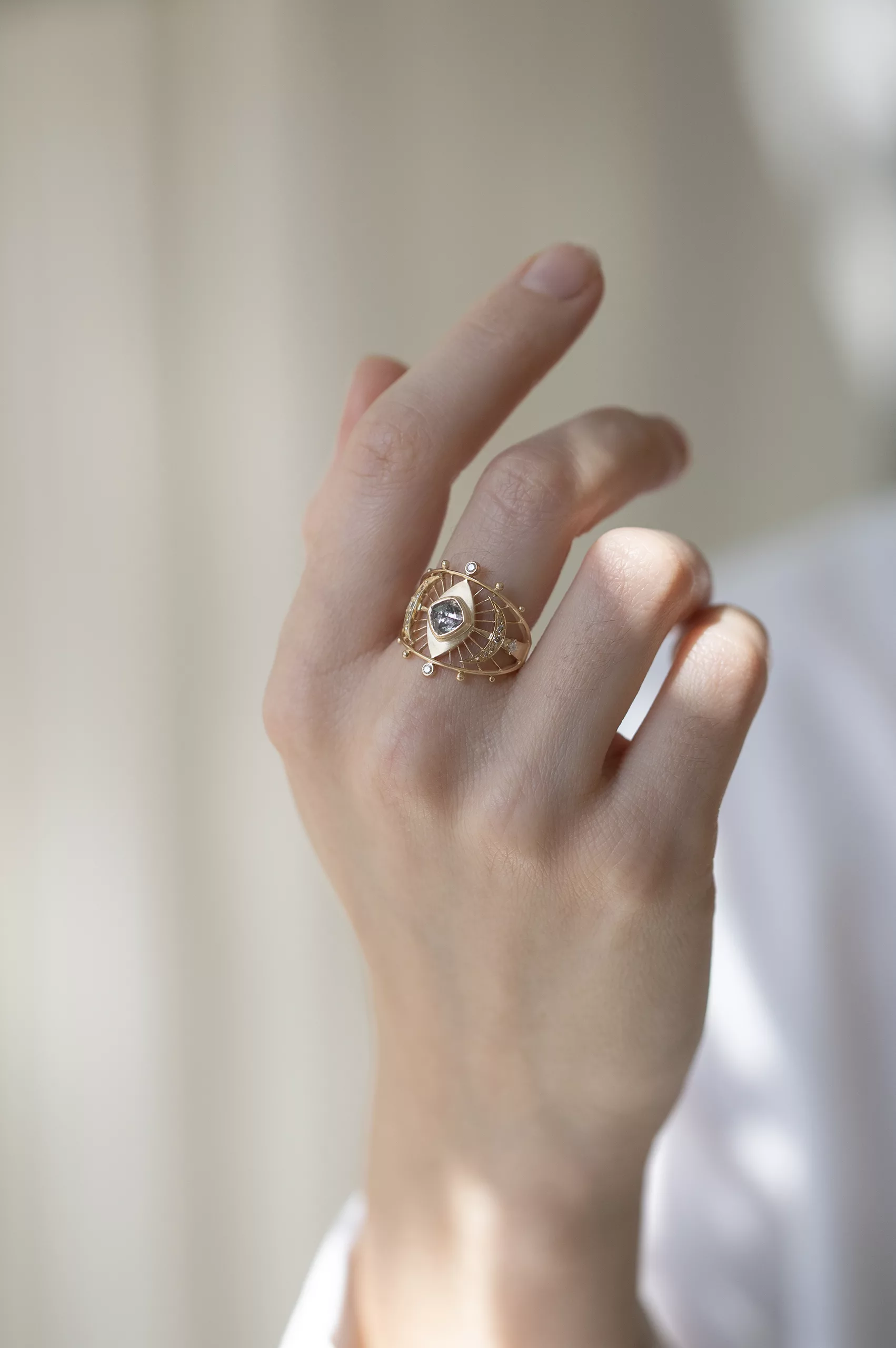 Gold wide ring grey diamond eye motif open geometric frame Celine Daoust