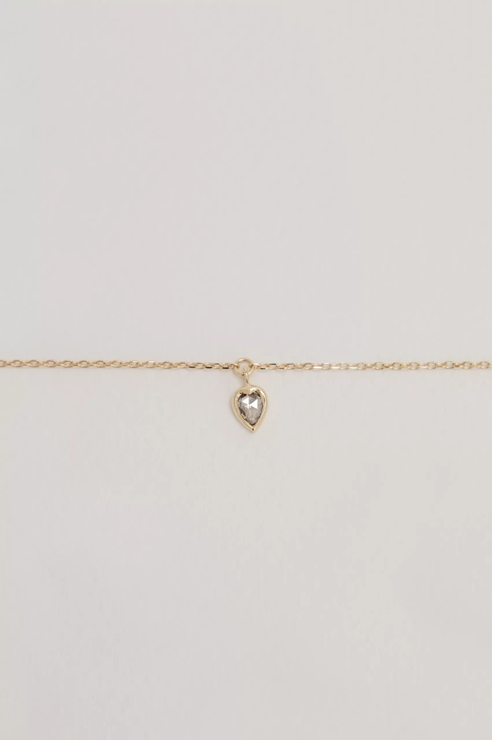 Fine gold chain bracelet champagne diamond heart bezel charm Céline Daoust