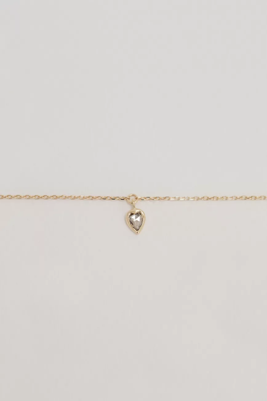 Fine gold chain bracelet champagne diamond heart bezel charm Céline Daoust