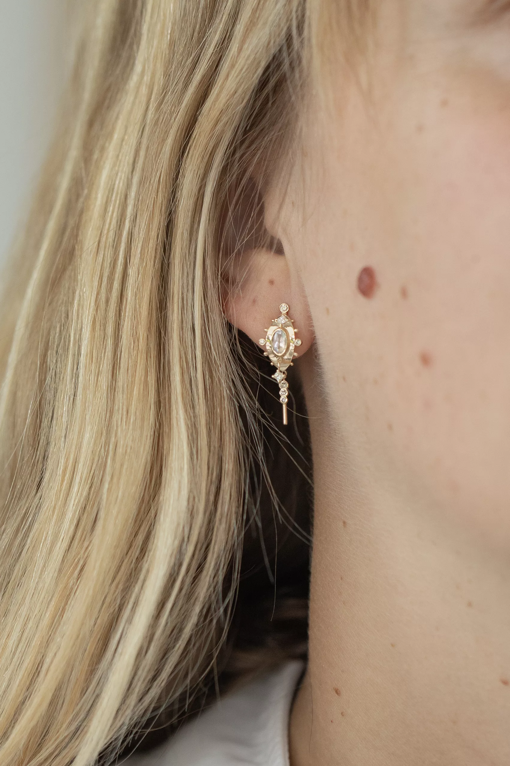 Yellow gold single drop earring oval moonstone diamond square accent spike drop Celine Daoust