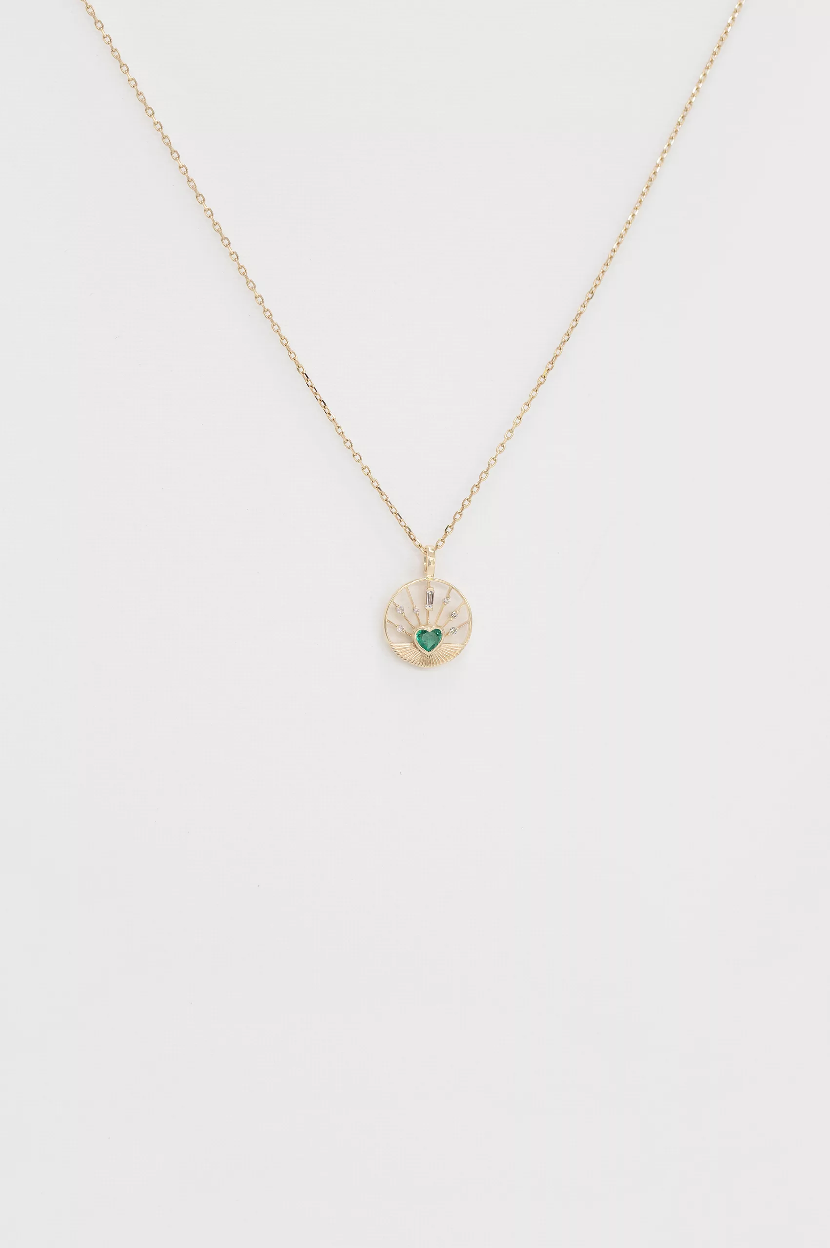 Gold necklace round open pendant heart-cut emerald center Céline Daoust