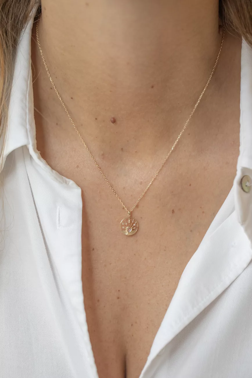 Yellow gold necklace round medal pendant moonstone heart motif delicate chain Celine Daoust