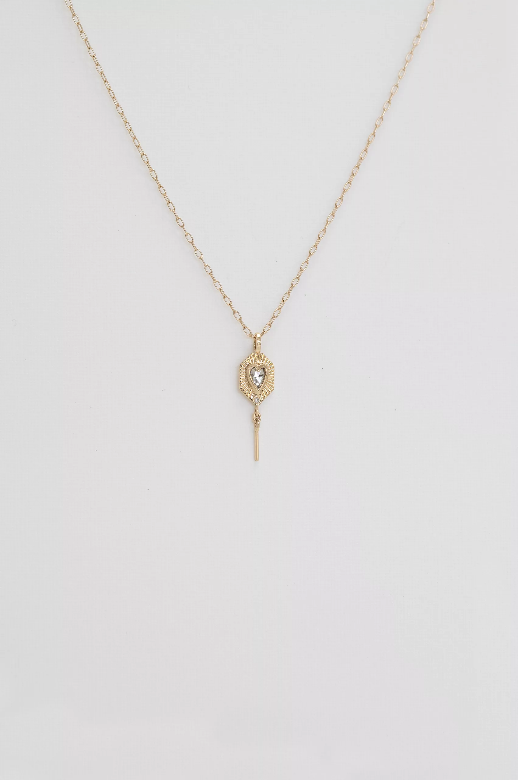 Yellow gold necklace small gold plate pendant champagne diamond heart motif spike drop Celine Daoust
