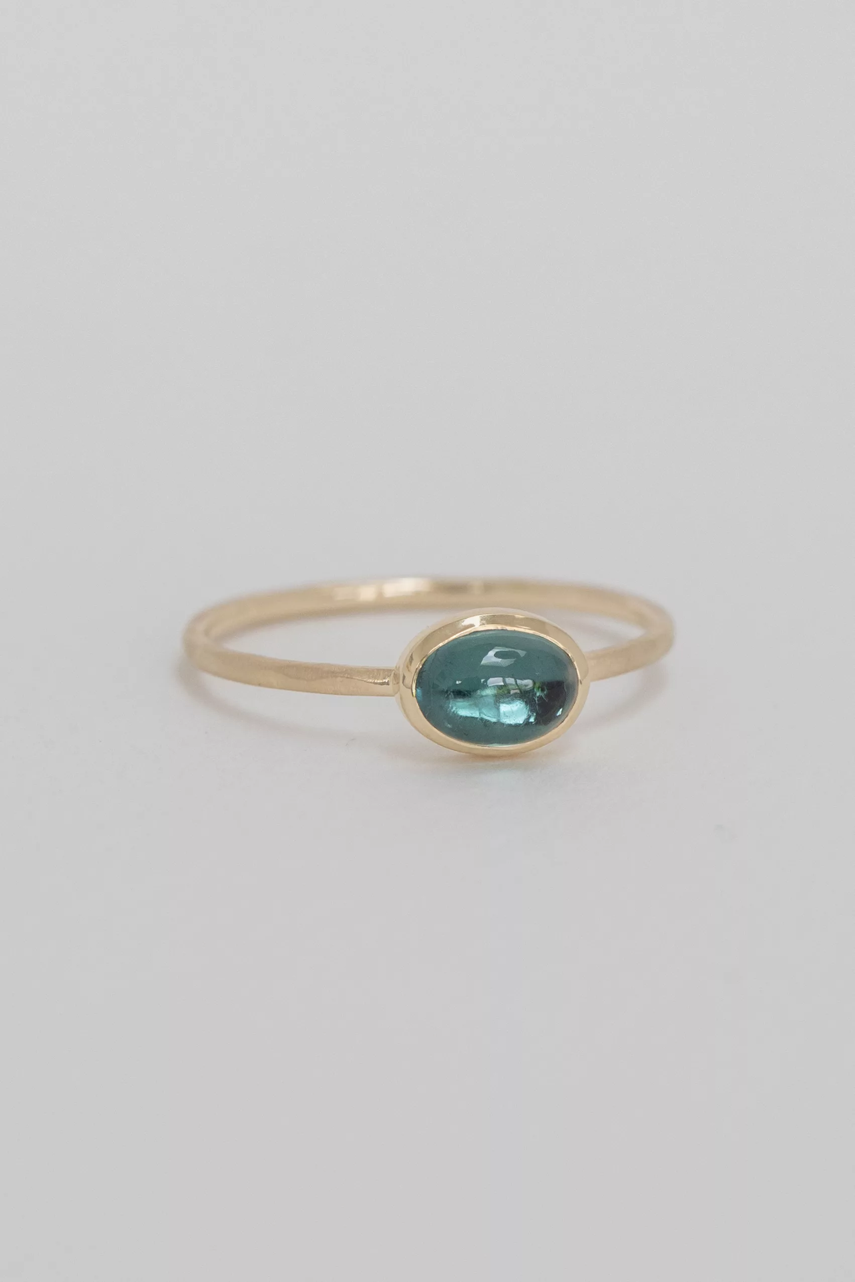 Yellow gold ring oval turquoise tourmaline cabochon open bezel slim band Celine Daoust