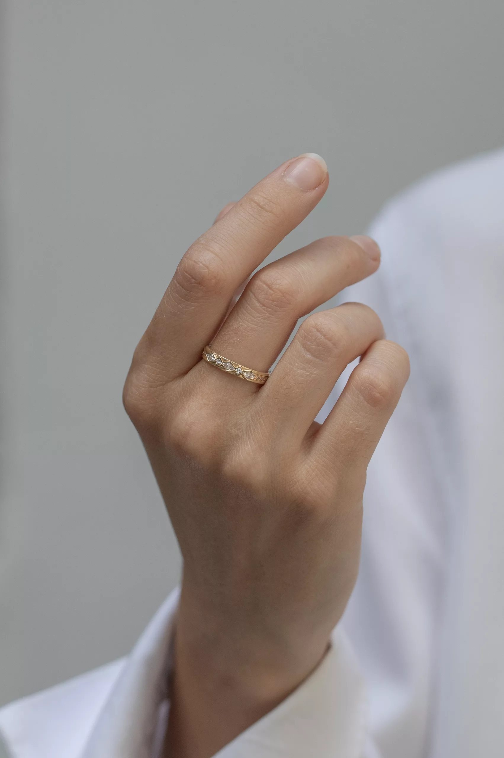 Yellow gold band ring multiple trillion-cut diamonds geometric setting Celine Daoust