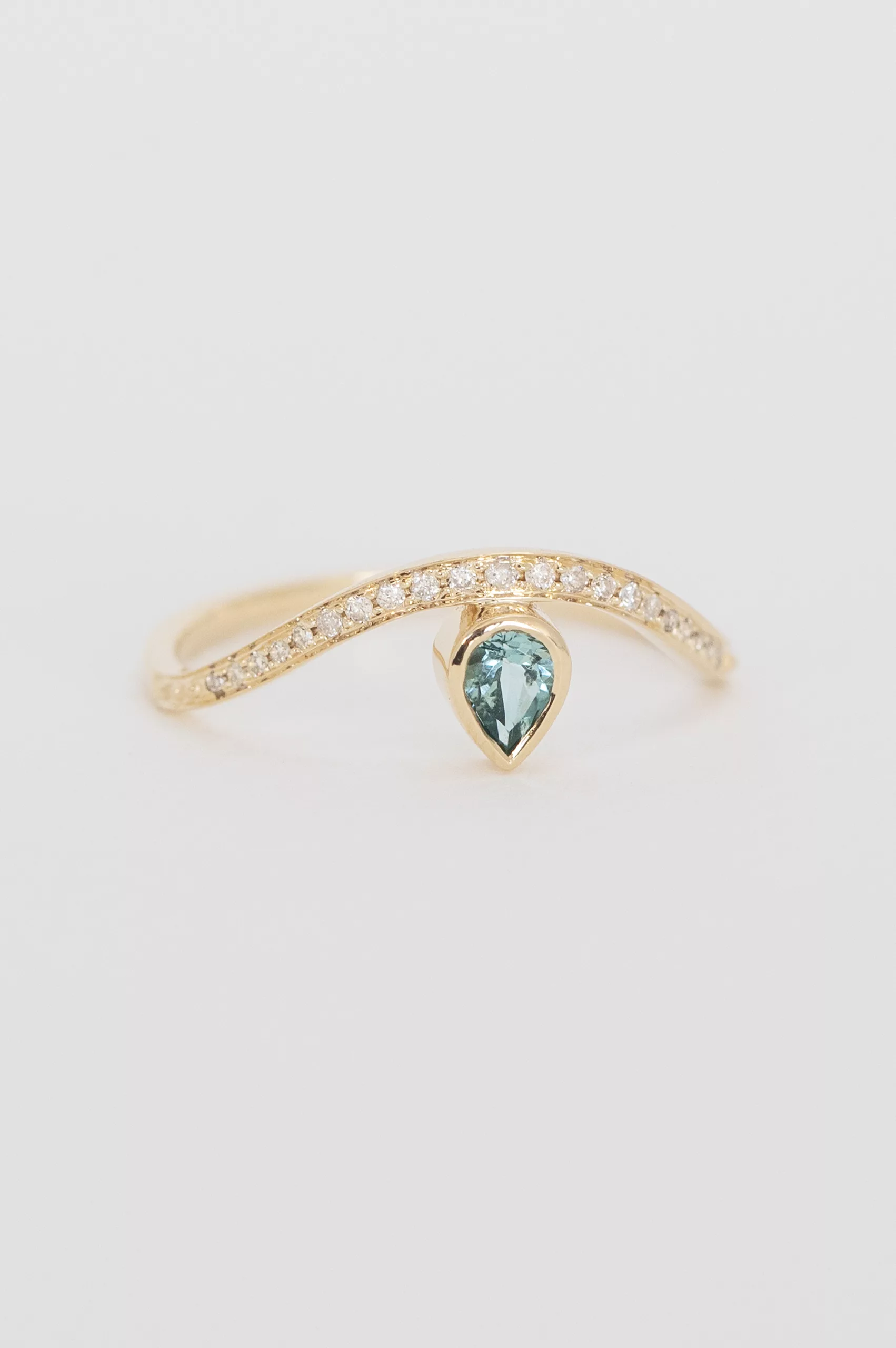 Gold wave ring pear blue tourmaline pavé diamond band Céline Daoust