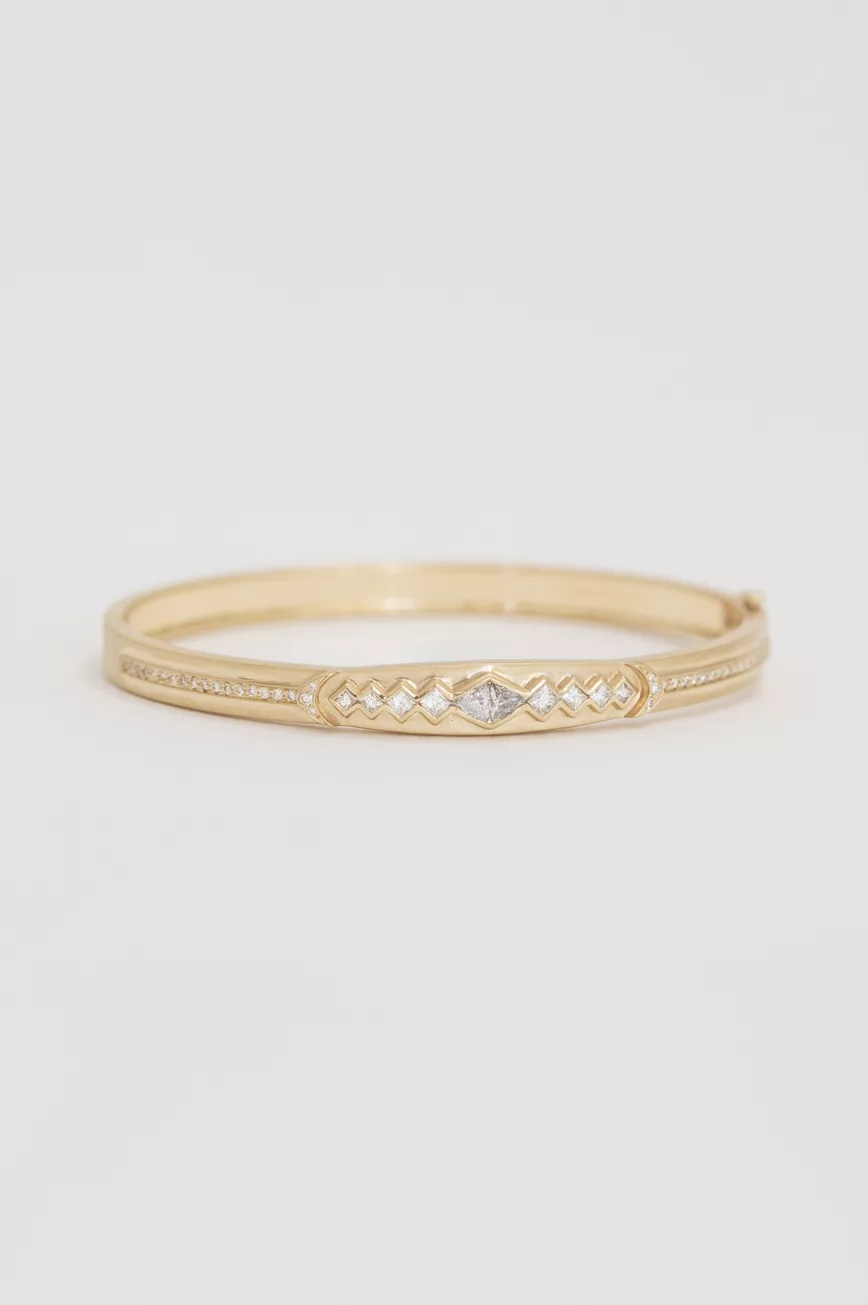 Gold bangle bracelet diamond triangle motifs pave diamond line Celine Daoust