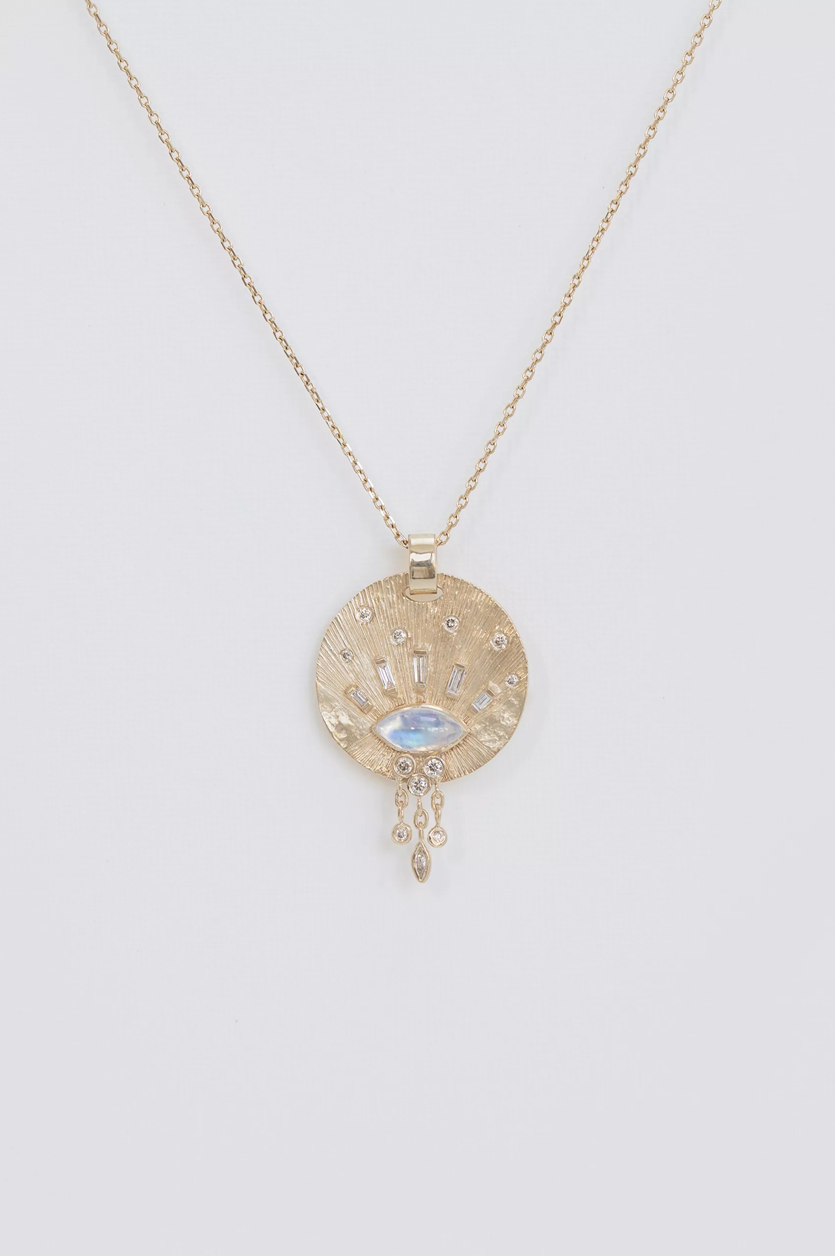 Gold medal necklace moonstone cabochon baguette diamonds sun motif Céline Daoust
