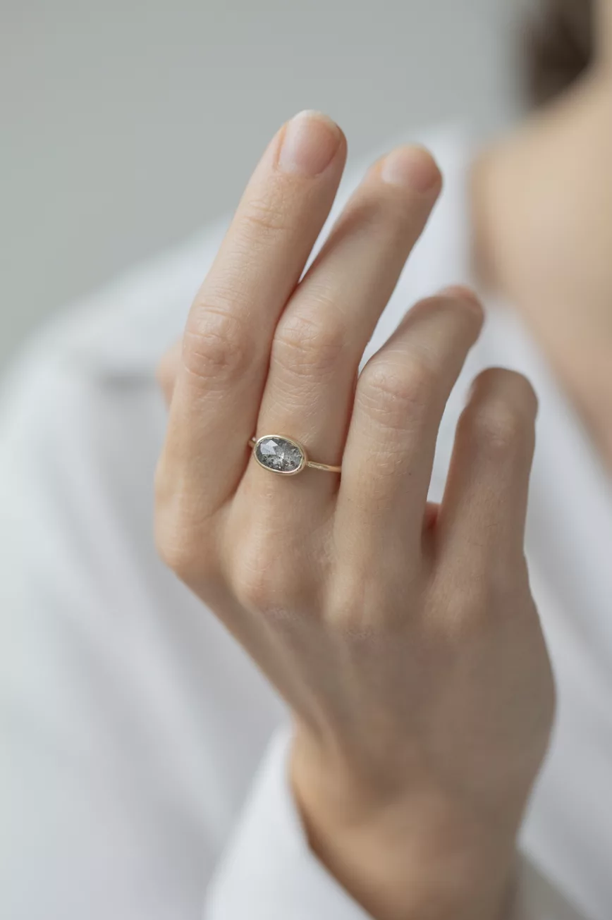 Yellow gold ring large oval grey diamond open bezel slim band Celine Daoust