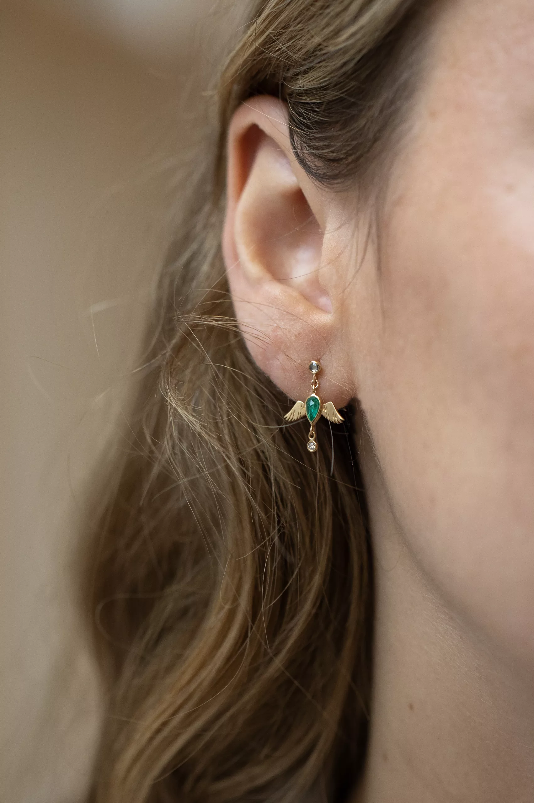 Yellow gold single drop earring sculpted bird motif pear emerald diamond accent Celine Daoust