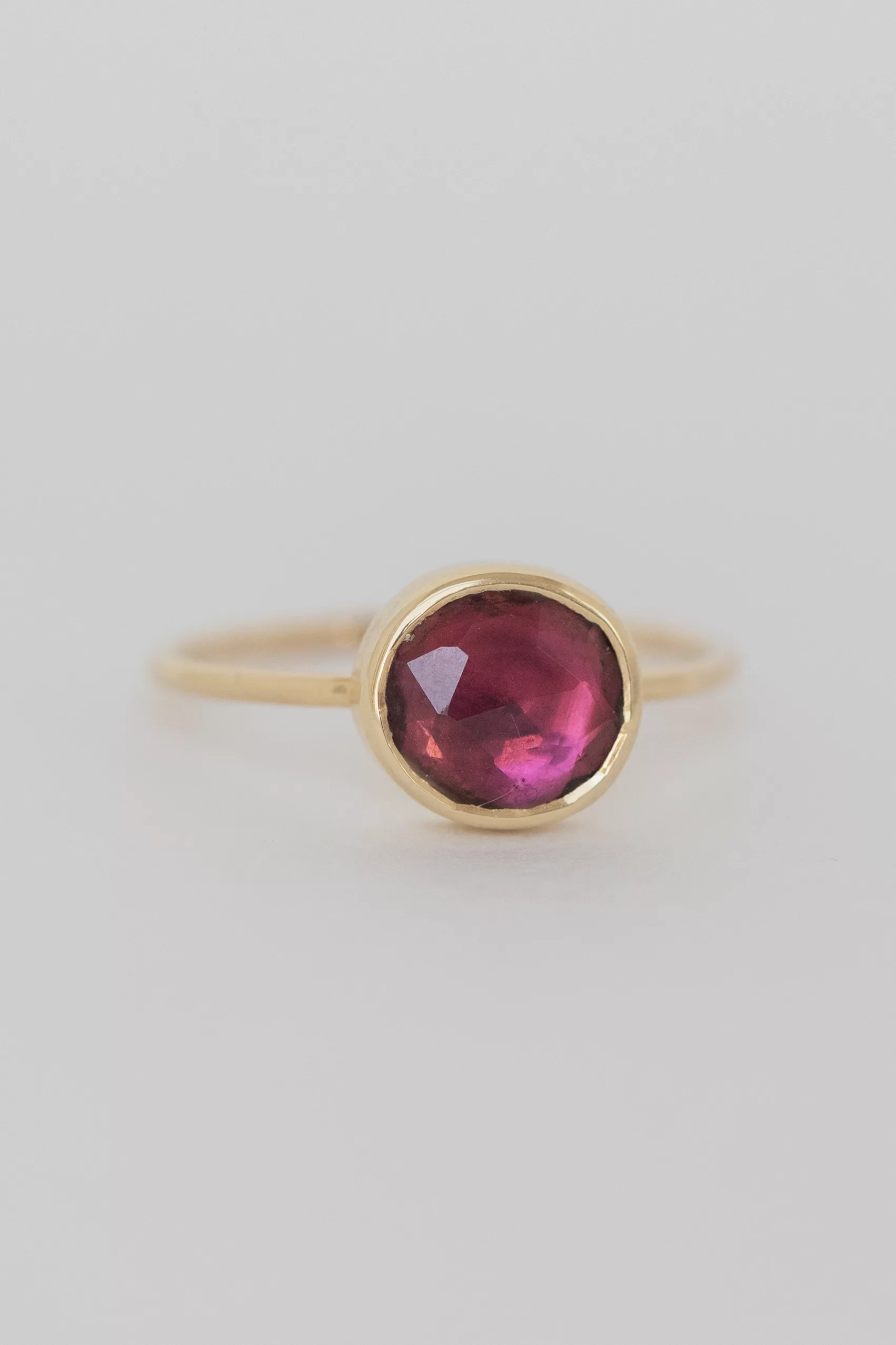 Yellow gold ring large oval pink tourmaline open bezel slim band Celine Daoust