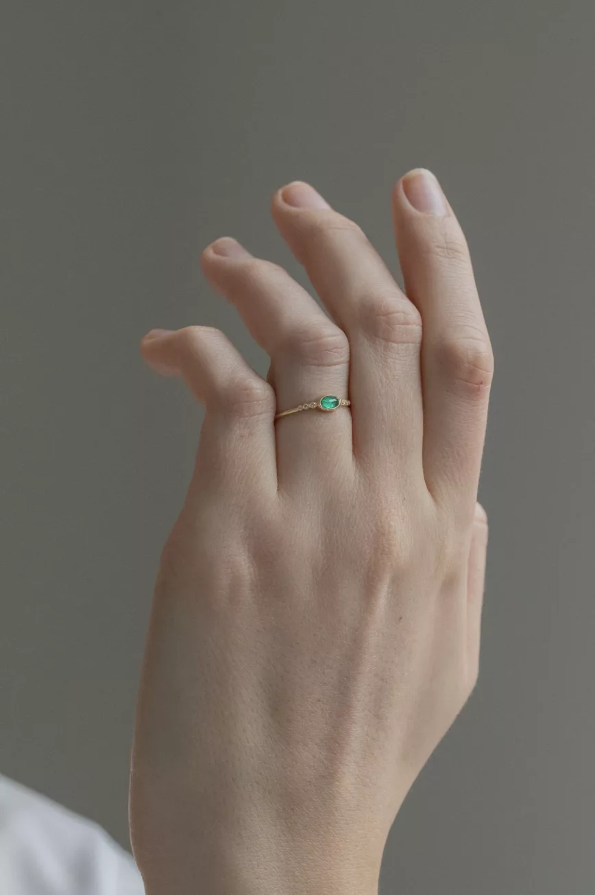 Yellow gold ring oval emerald diamond accent band Celine Daoust