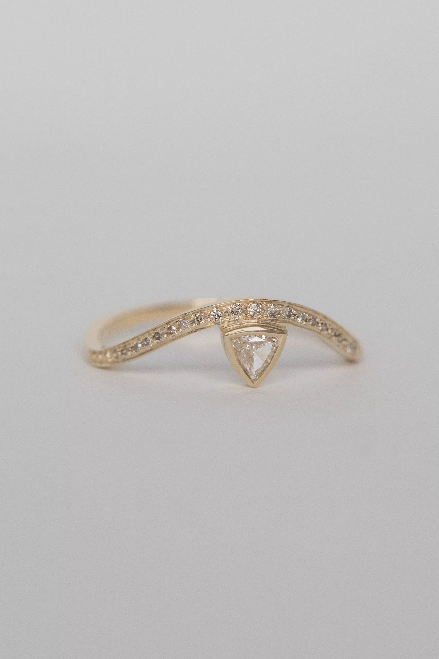 Yellow gold wave ring triangle champagne diamond pavé diamond curved band Celine Daoust