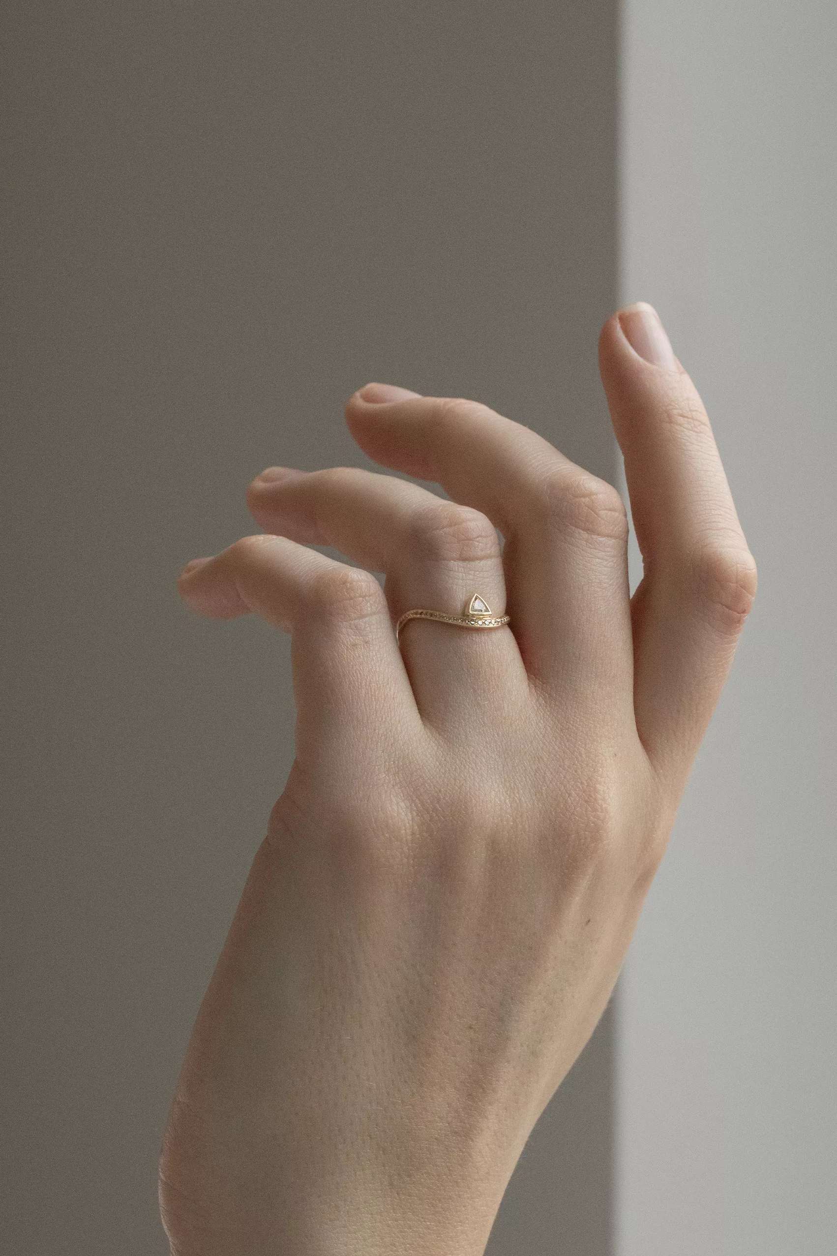 Yellow gold wave ring triangle champagne diamond pavé diamond curved band Celine Daoust
