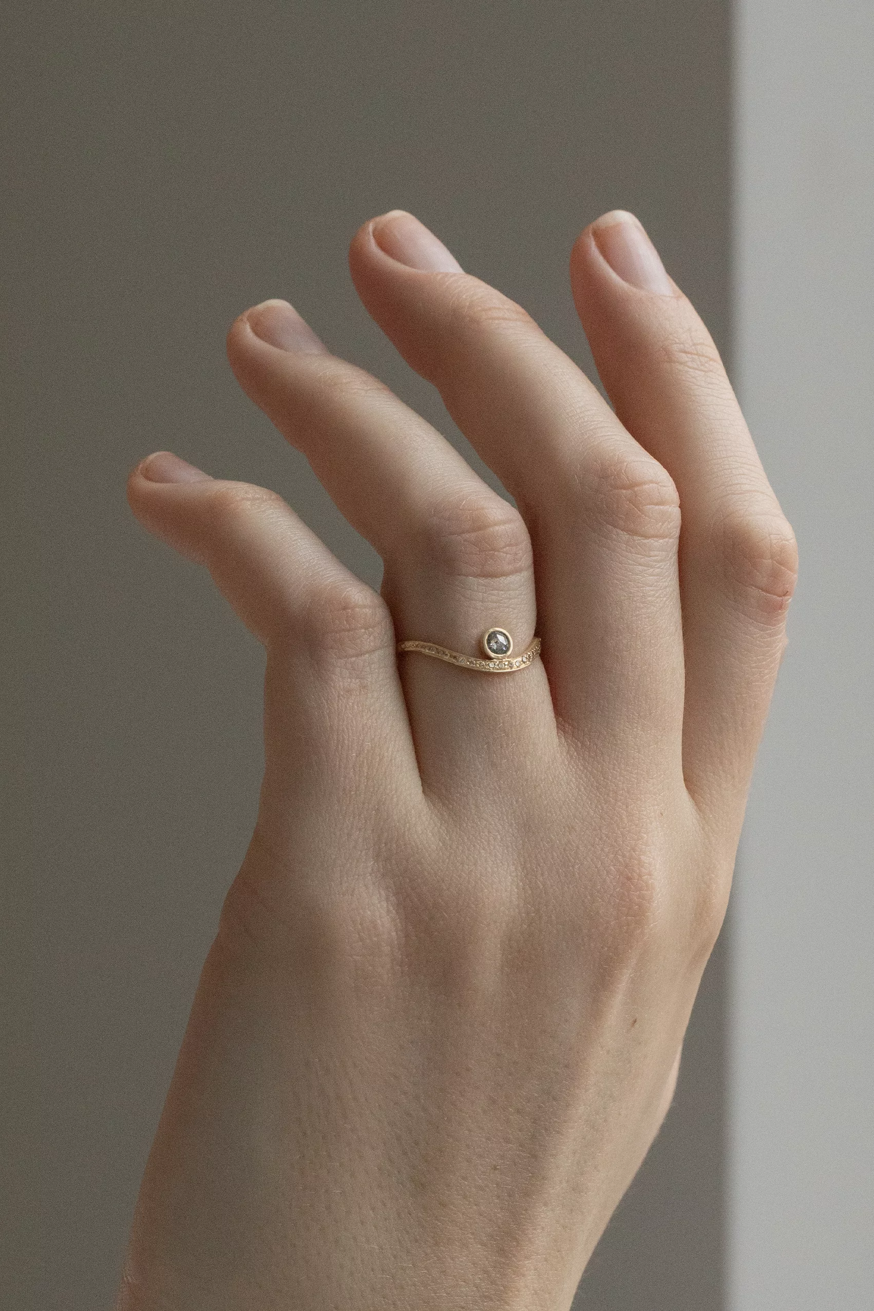 Yellow gold wave ring round grey diamond pavé diamond curved band Celine Daoust