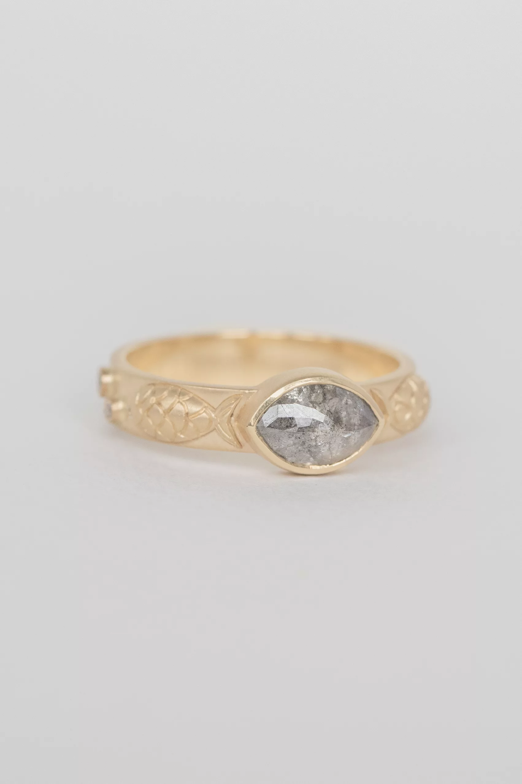 Yellow gold engraved band ring oval grey diamond fish motif Celine Daoust