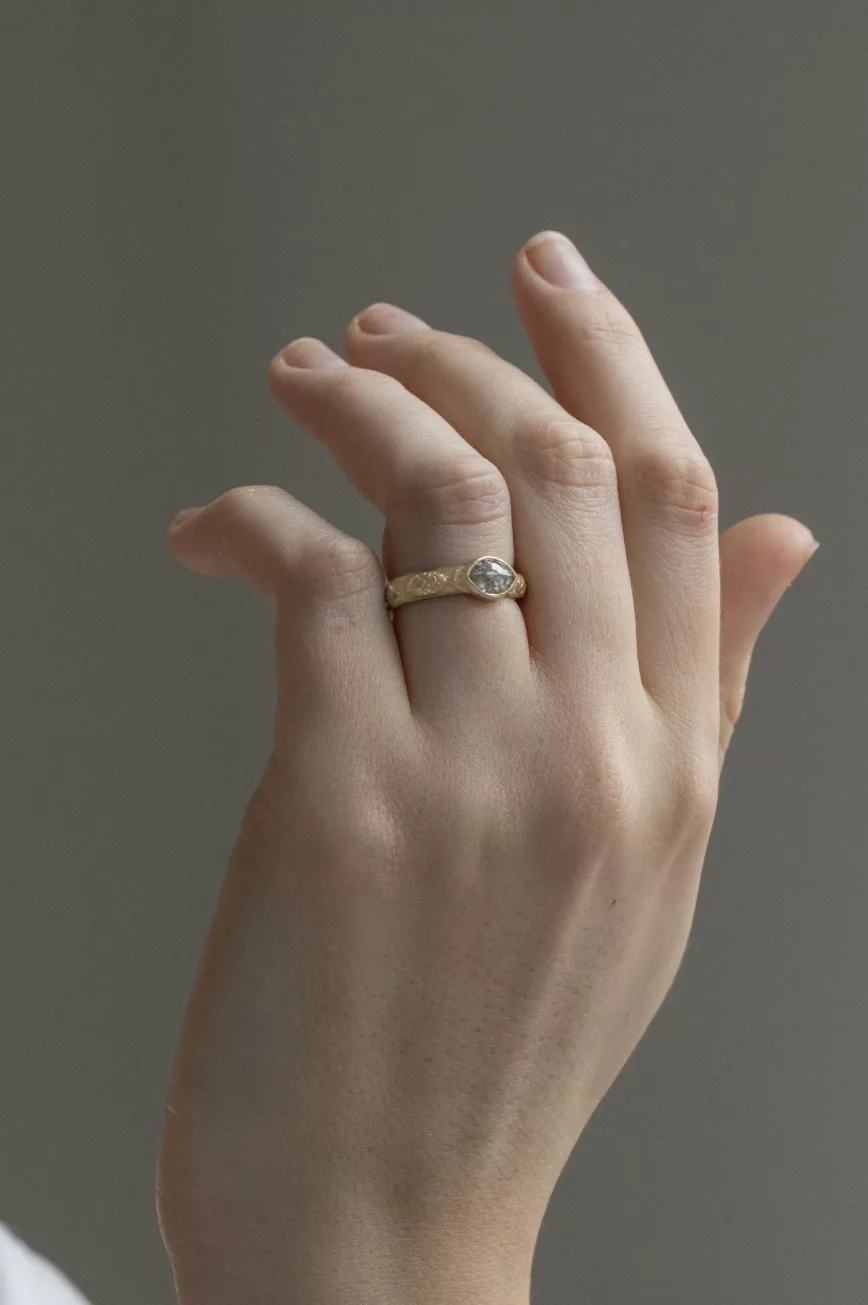 Yellow gold engraved band ring oval grey diamond fish motif Celine Daoust
