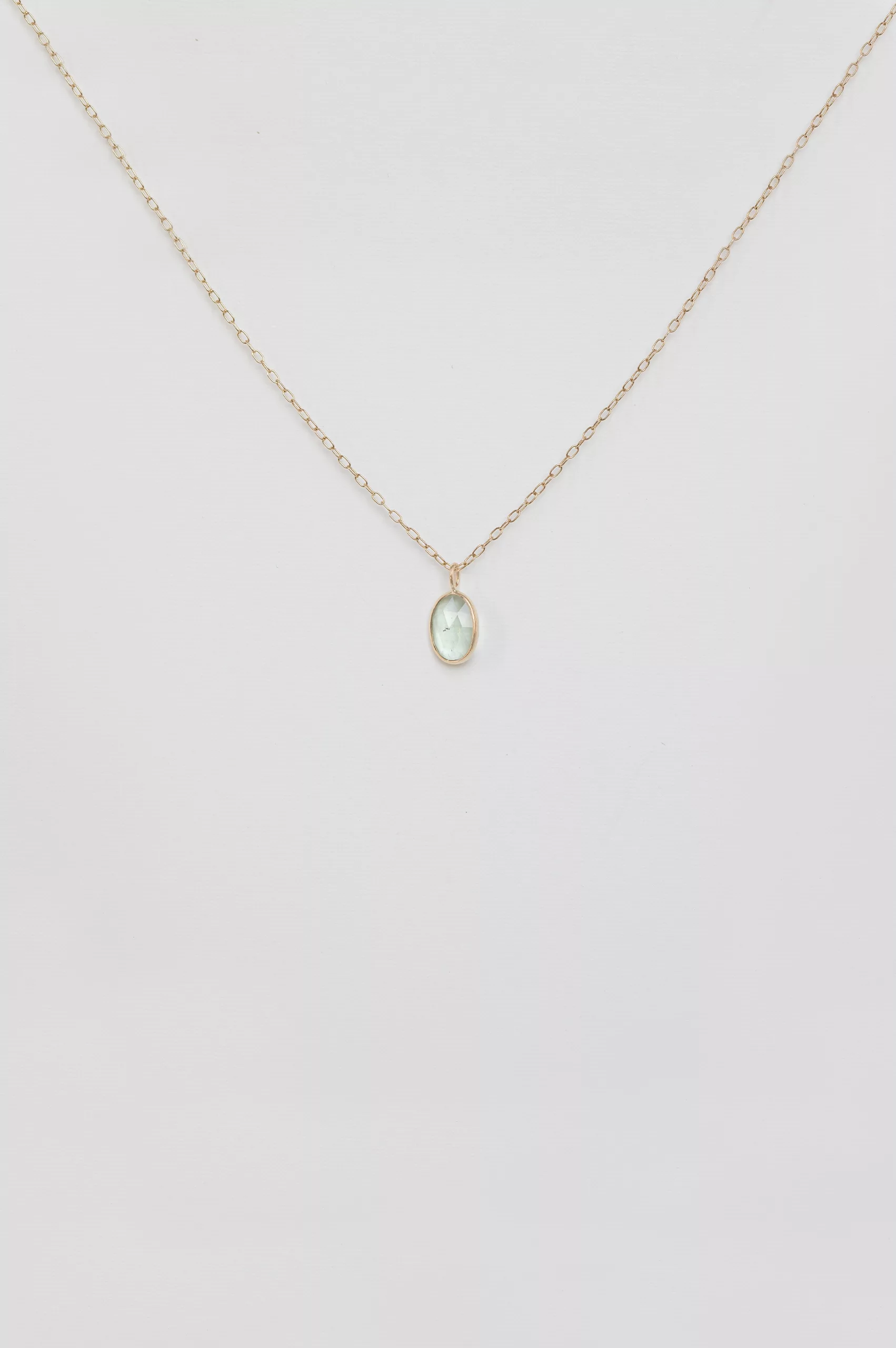Yellow gold necklace oval light green tourmaline bezel pendant delicate chain Celine Daoust