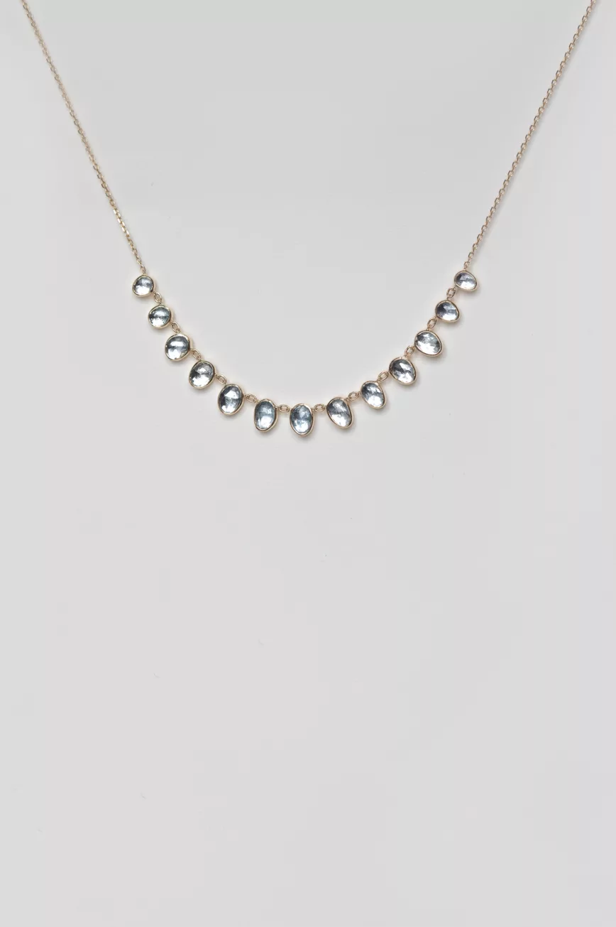 Yellow gold necklace multiple oval aquamarine bezel drops curved chain Celine Daoust