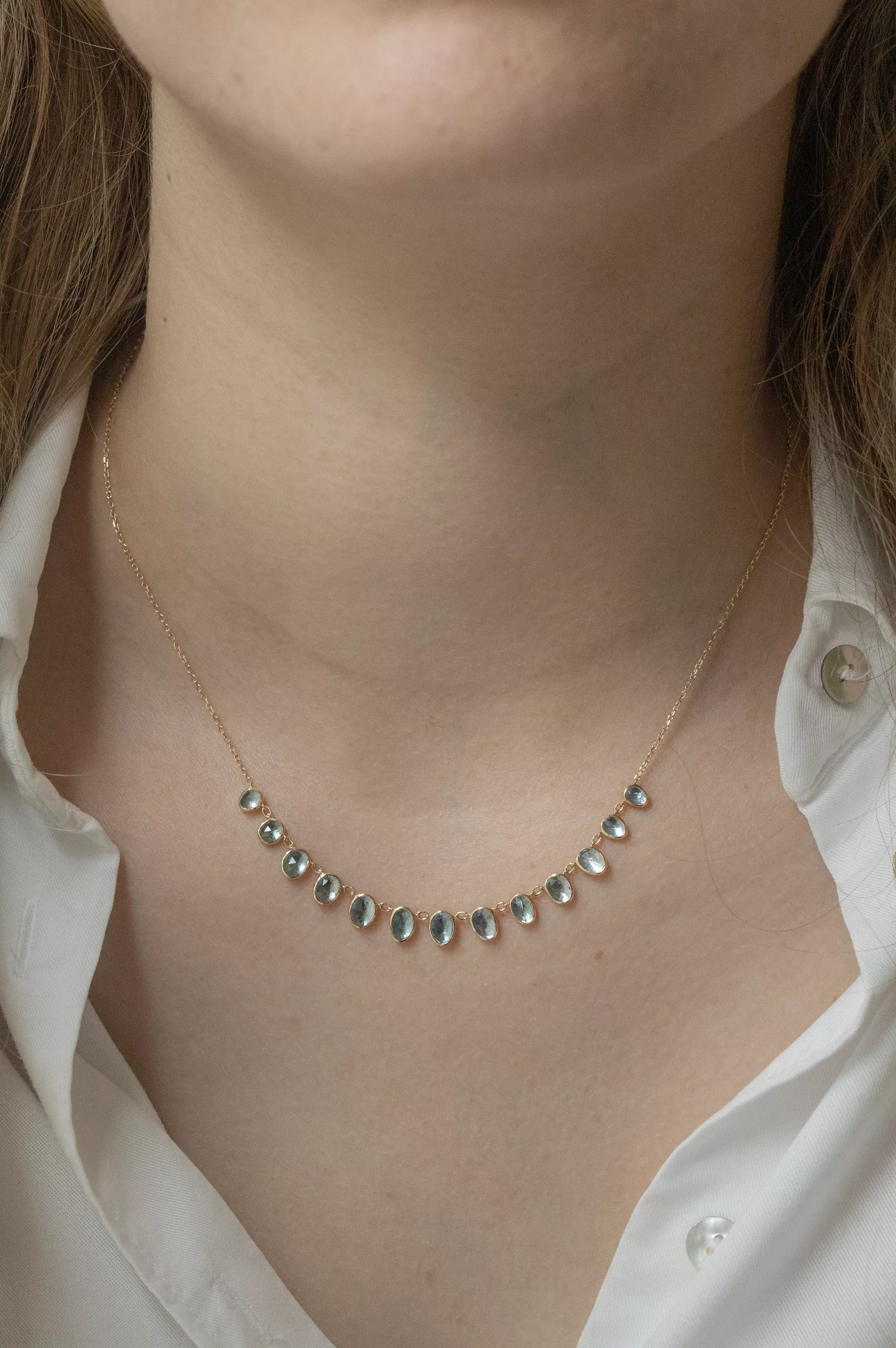 Yellow gold necklace multiple oval aquamarine bezel drops curved chain Celine Daoust