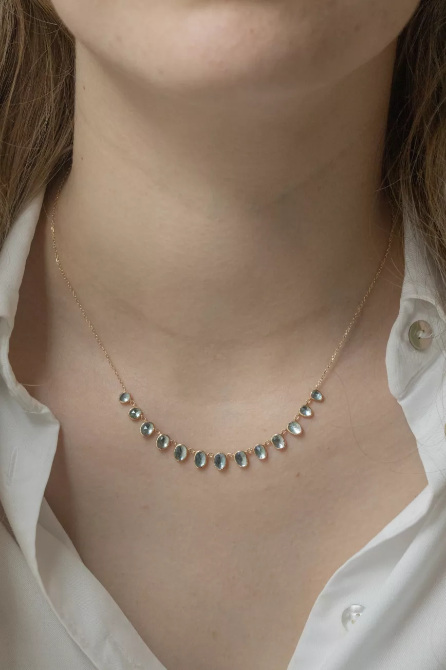 Yellow gold necklace multiple oval aquamarine bezel drops curved chain Celine Daoust