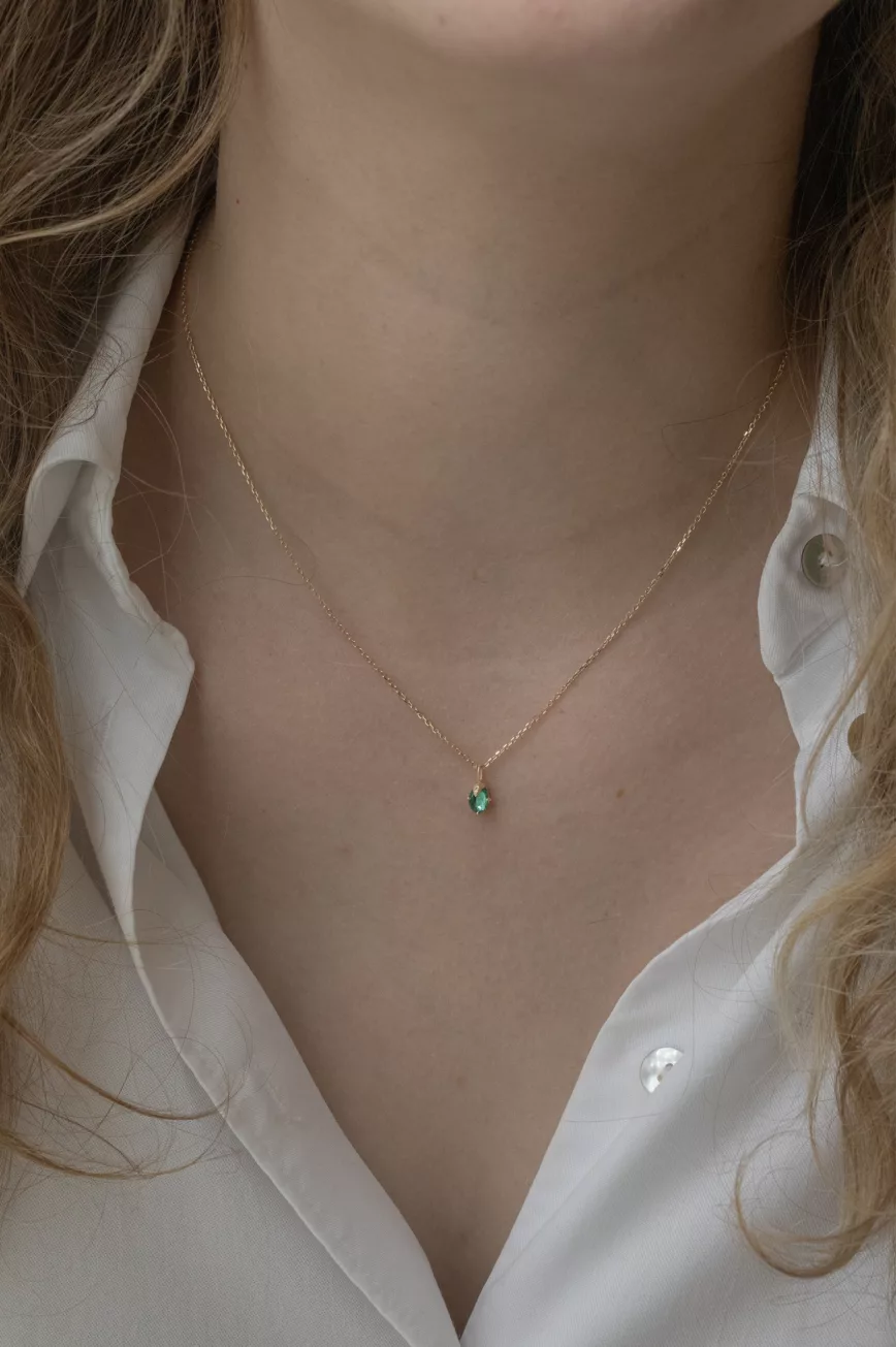 Yellow gold necklace round emerald claw setting pendant delicate chain Celine Daoust