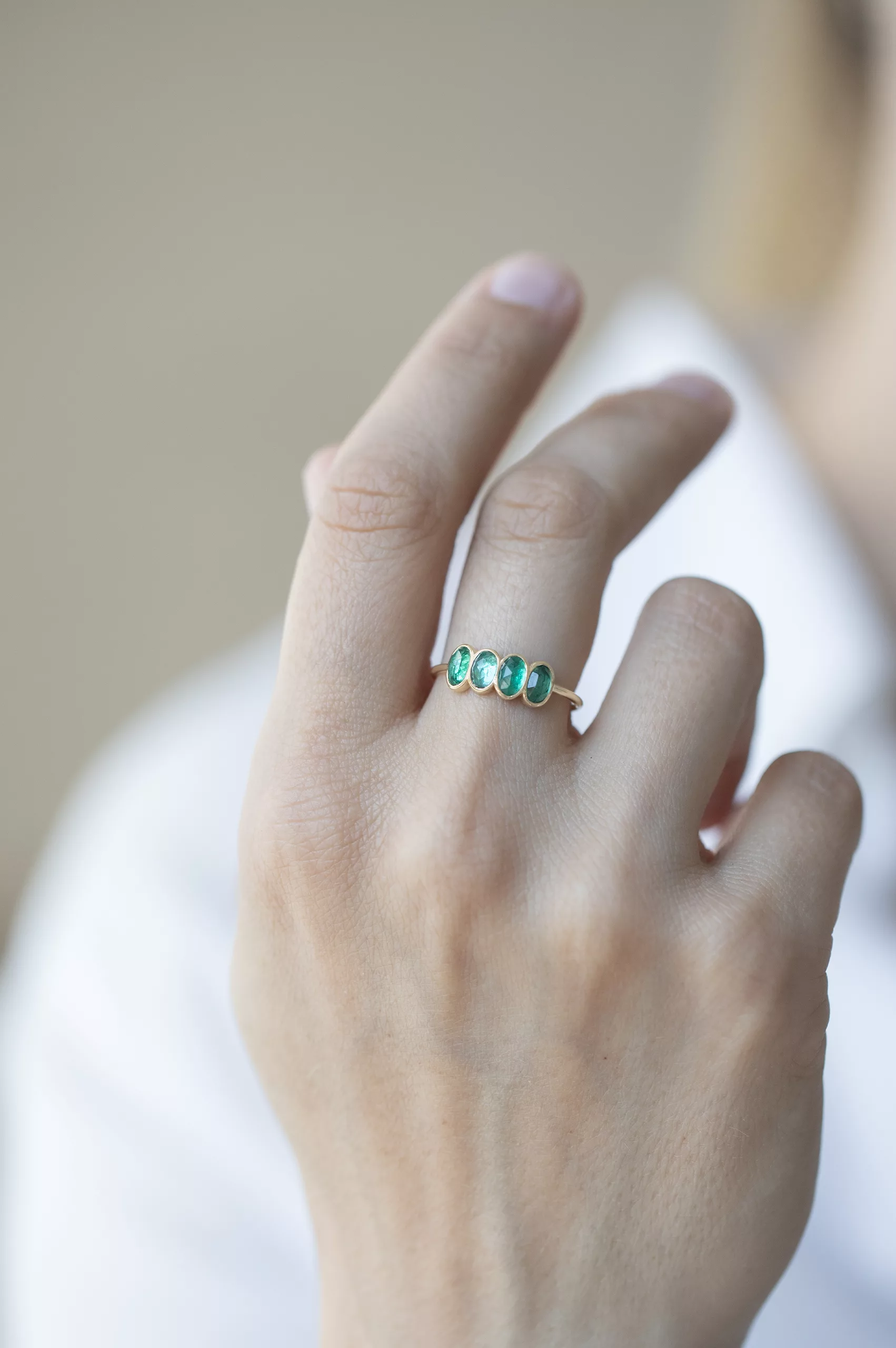 Yellow gold ring four oval emerald bezel set band Celine Daoust