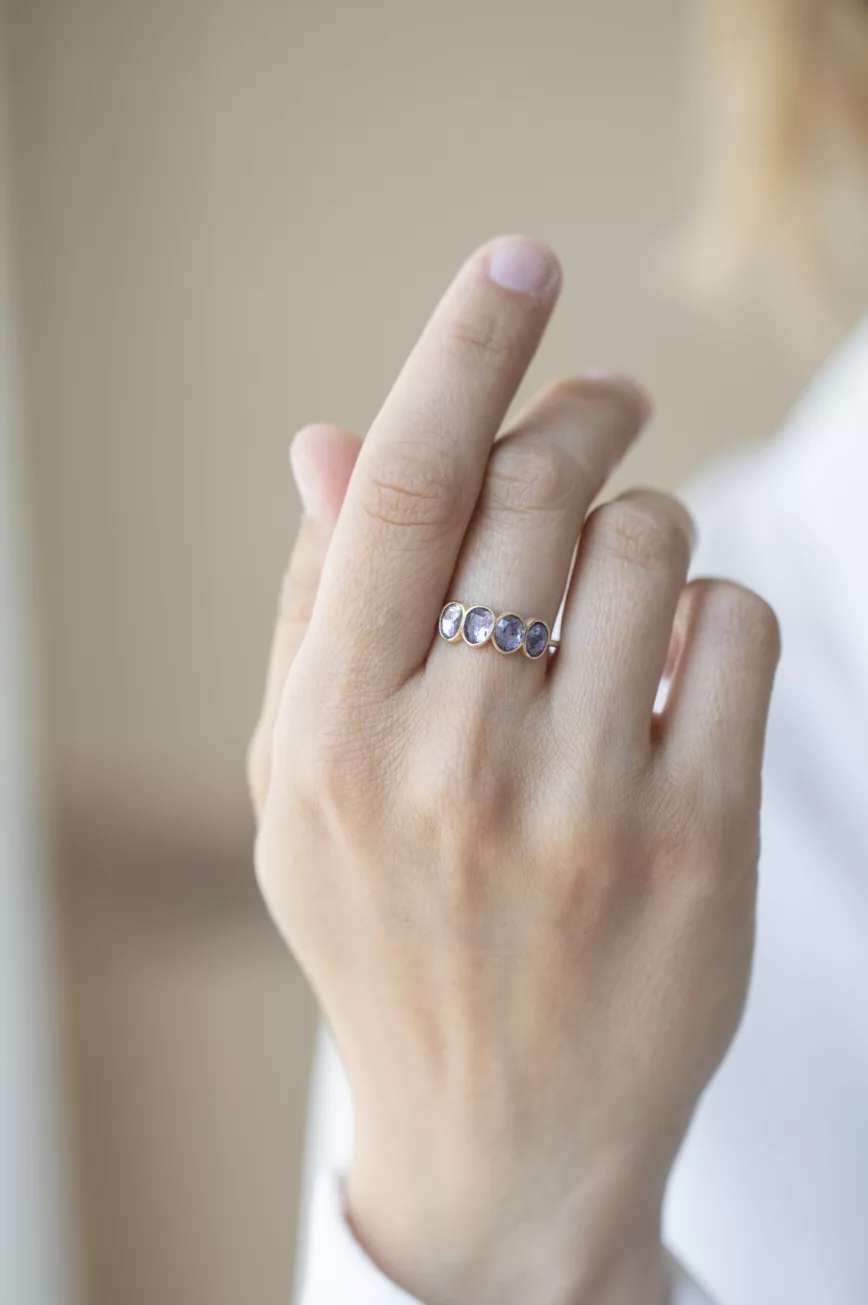 Yellow gold ring four oval tanzanite bezel set band Celine Daoust