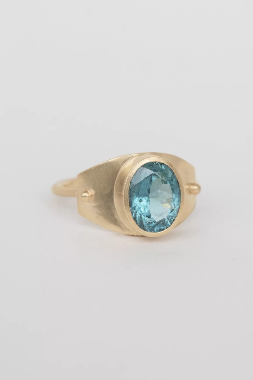 Gold signet ring large oval light blue tourmaline matte bezel Céline Daoust
