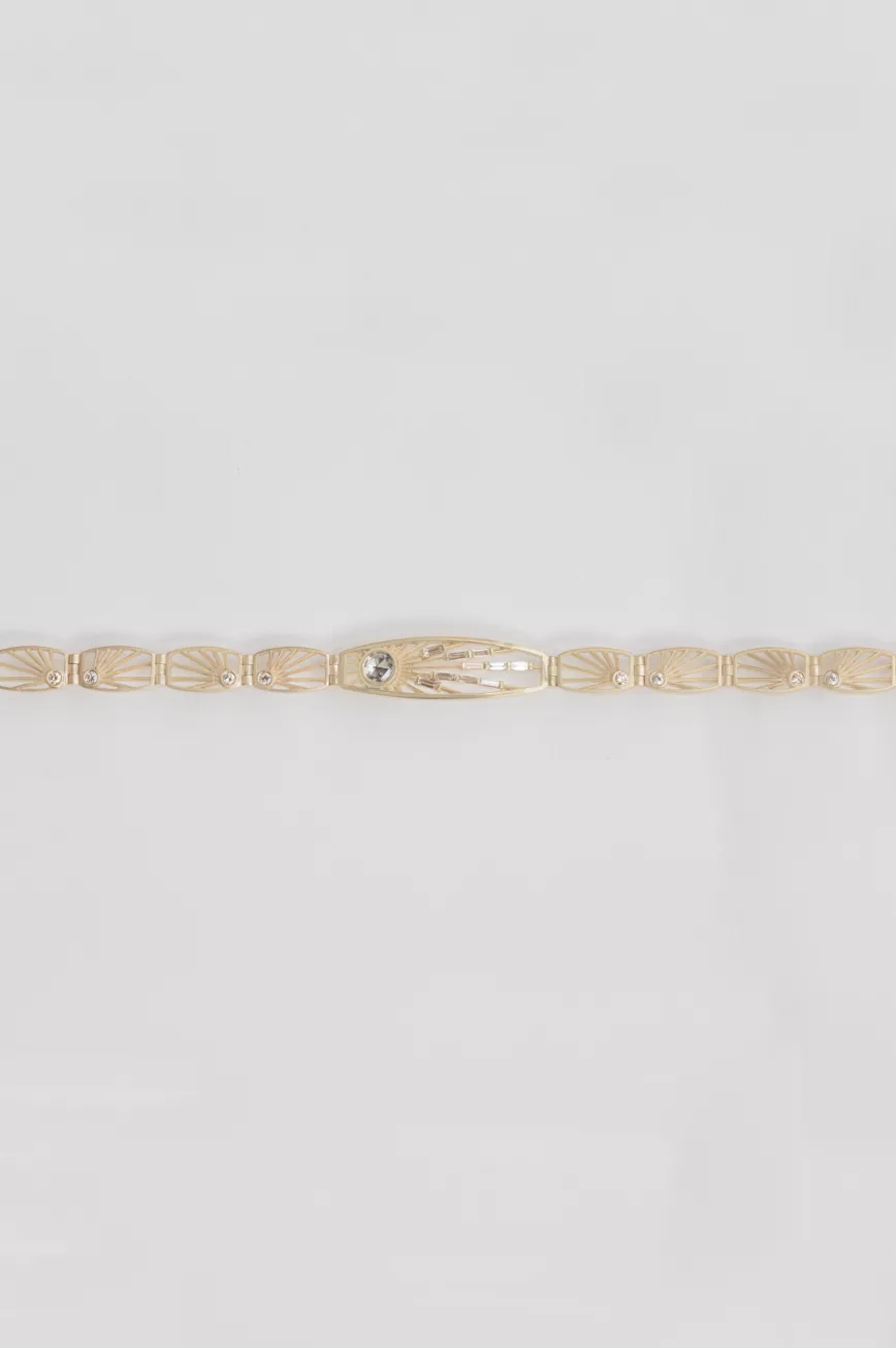 Gold articulated bracelet engraved sun links grey diamond center Céline Daoust
