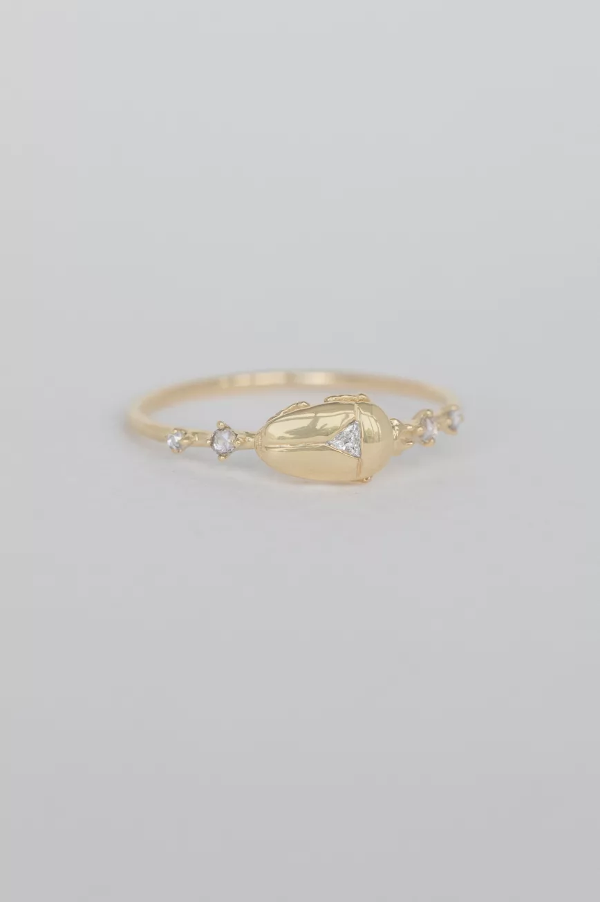 Gold ring sculpted scarab motif diamond accents Céline Daoust