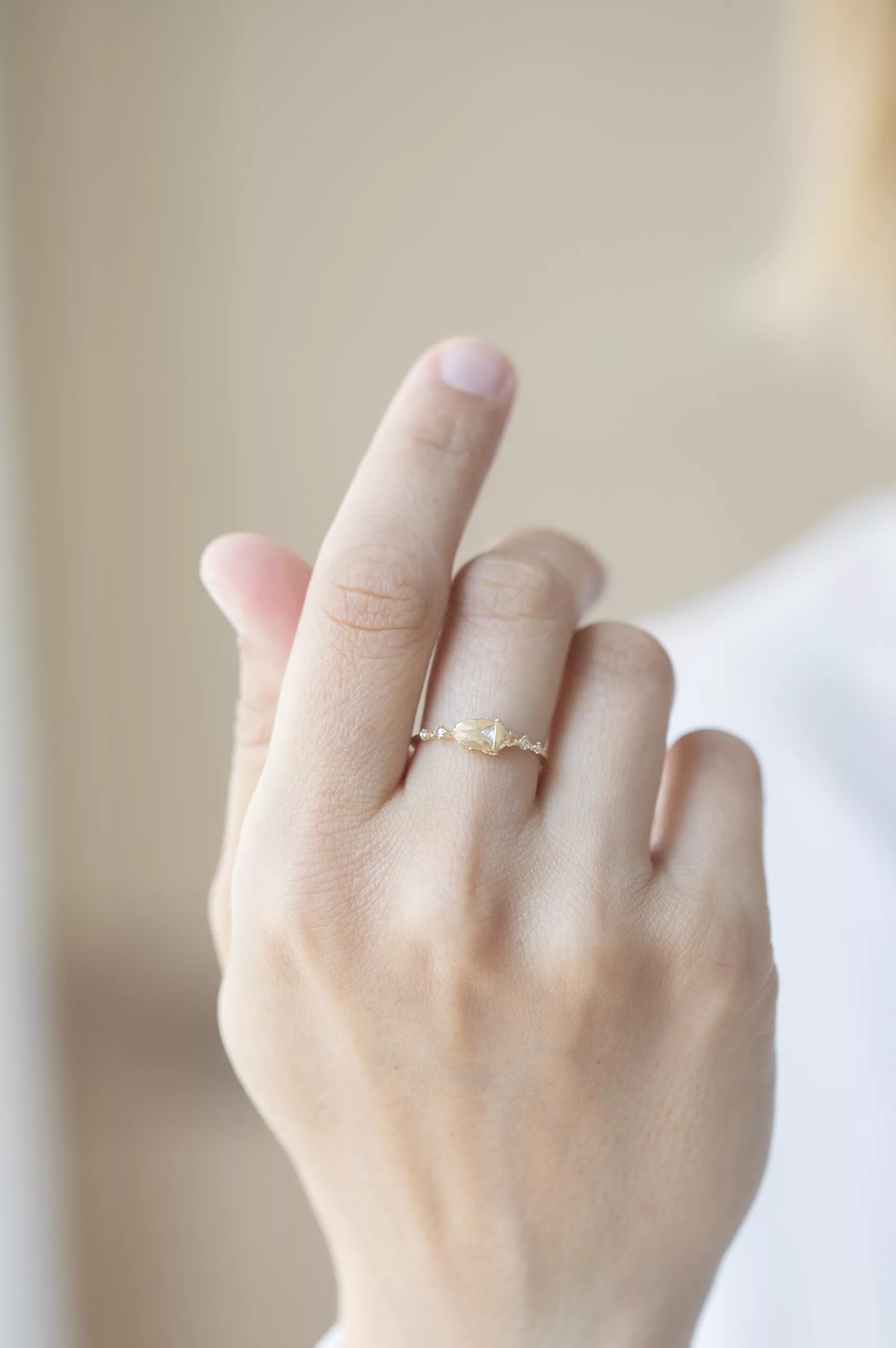 Gold ring sculpted scarab motif diamond accents Céline Daoust