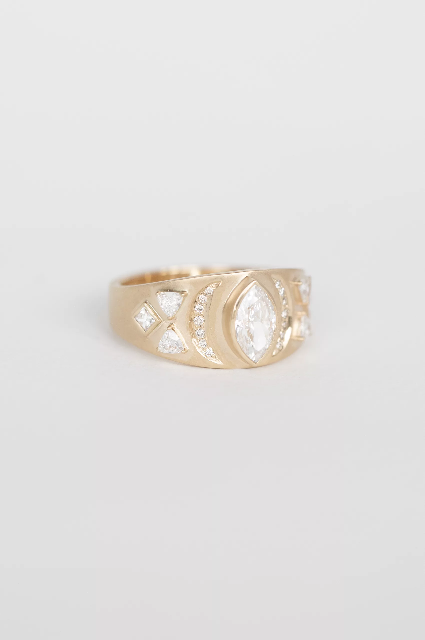 Yellow gold signet ring marquise diamond geometric engraved motif Céline Daoust