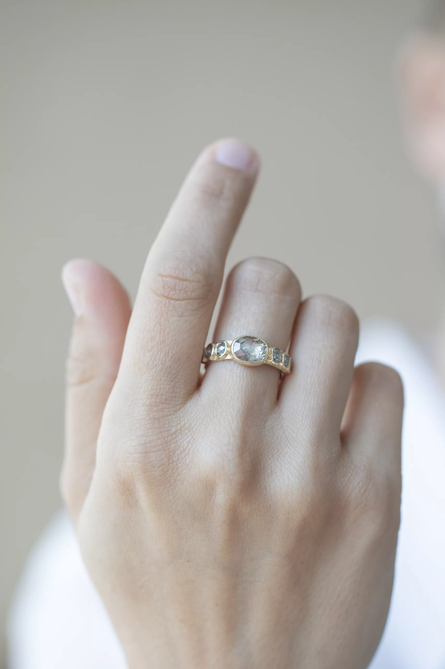 Yellow gold wide band ring oval grey diamond six grey diamond accents Celine Daoust