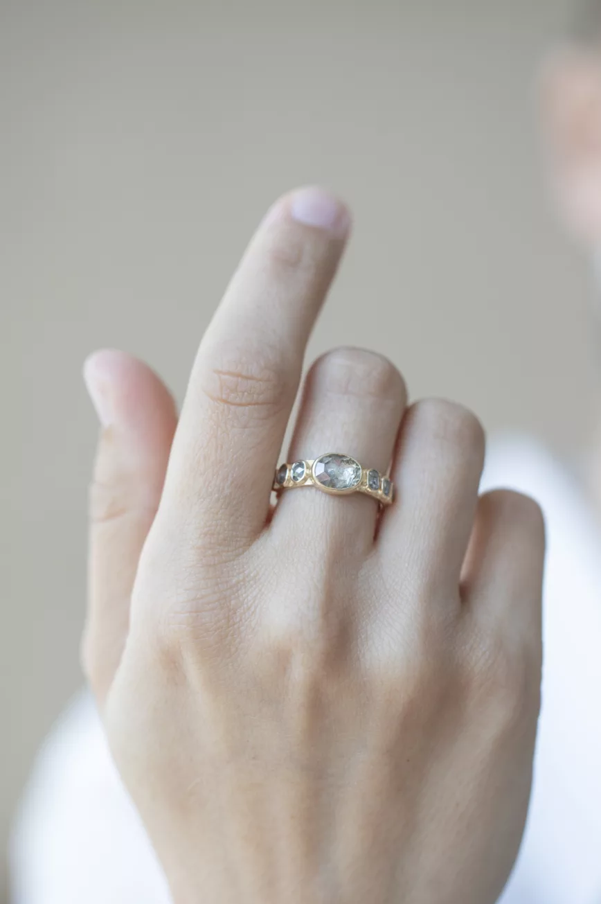 Yellow gold wide band ring oval grey diamond six grey diamond accents Celine Daoust