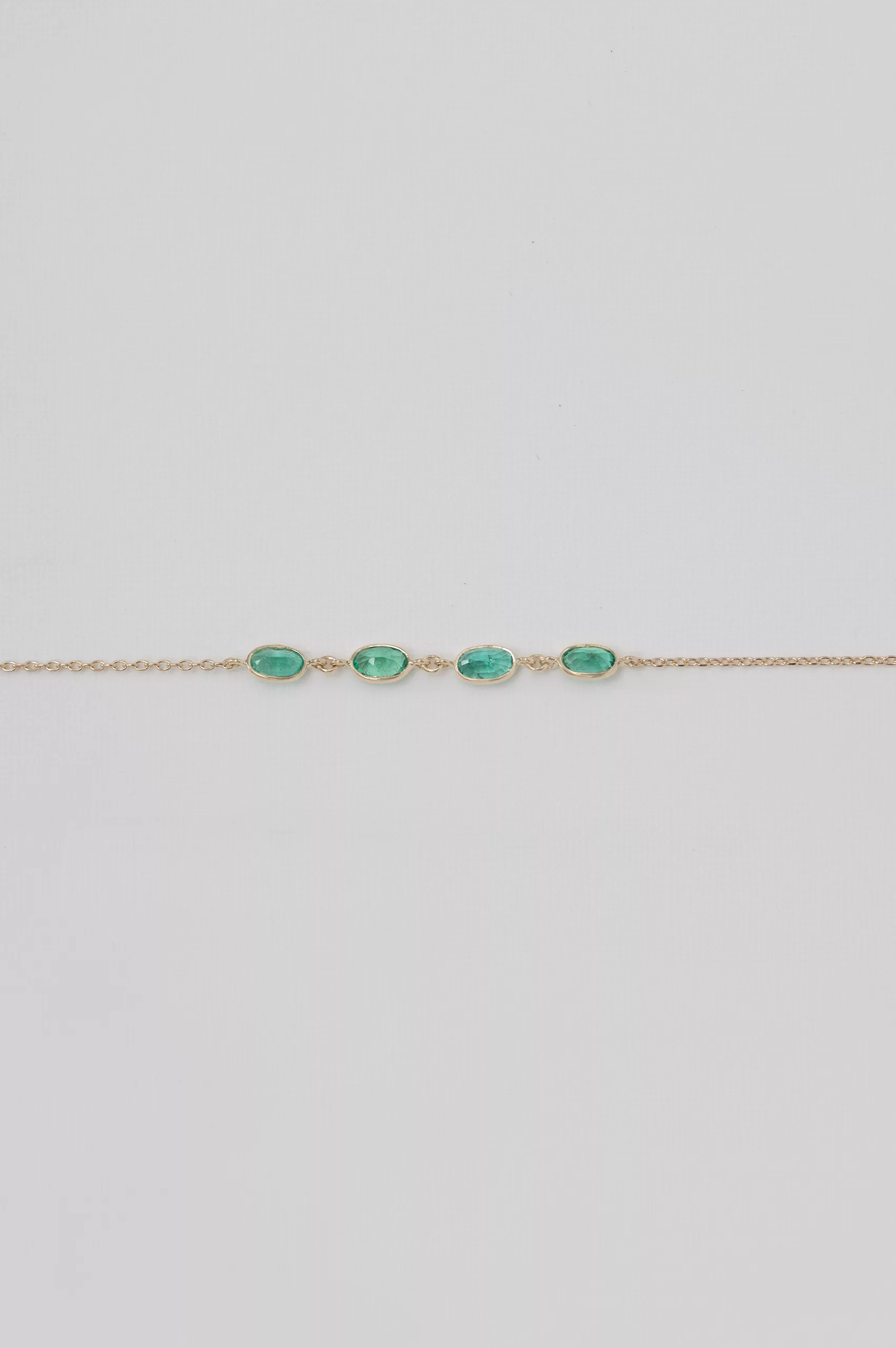Yellow gold chain bracelet multiple oval emerald bezel stations Celine Daoust