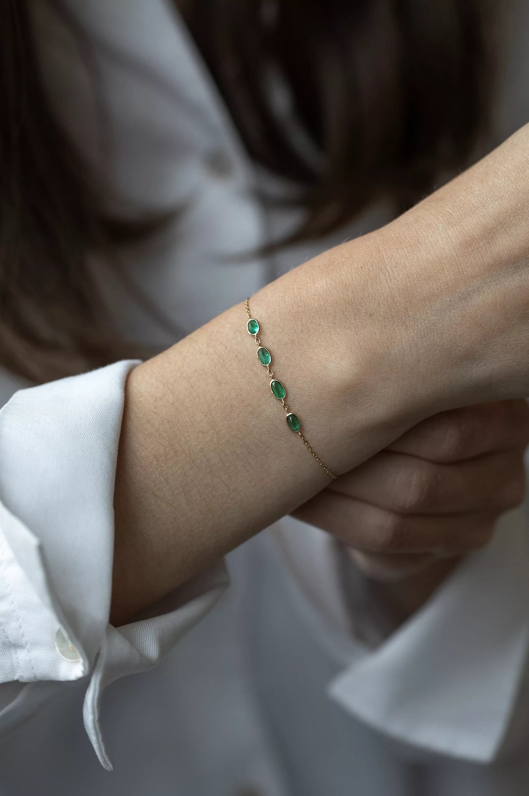 Yellow gold chain bracelet multiple oval emerald bezel stations Celine Daoust