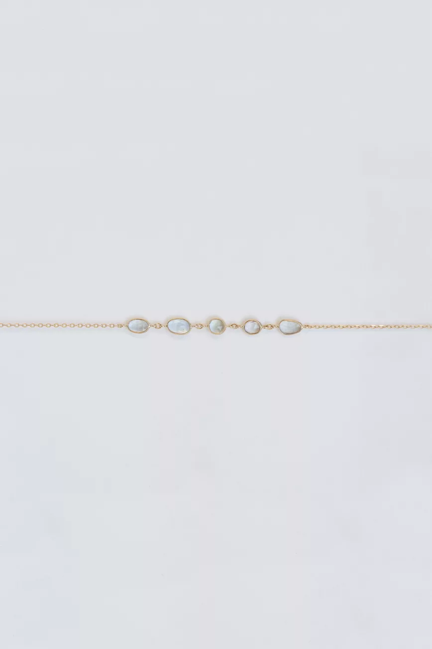Yellow gold chain bracelet multiple oval blue tourmaline bezel stations Celine Daoust