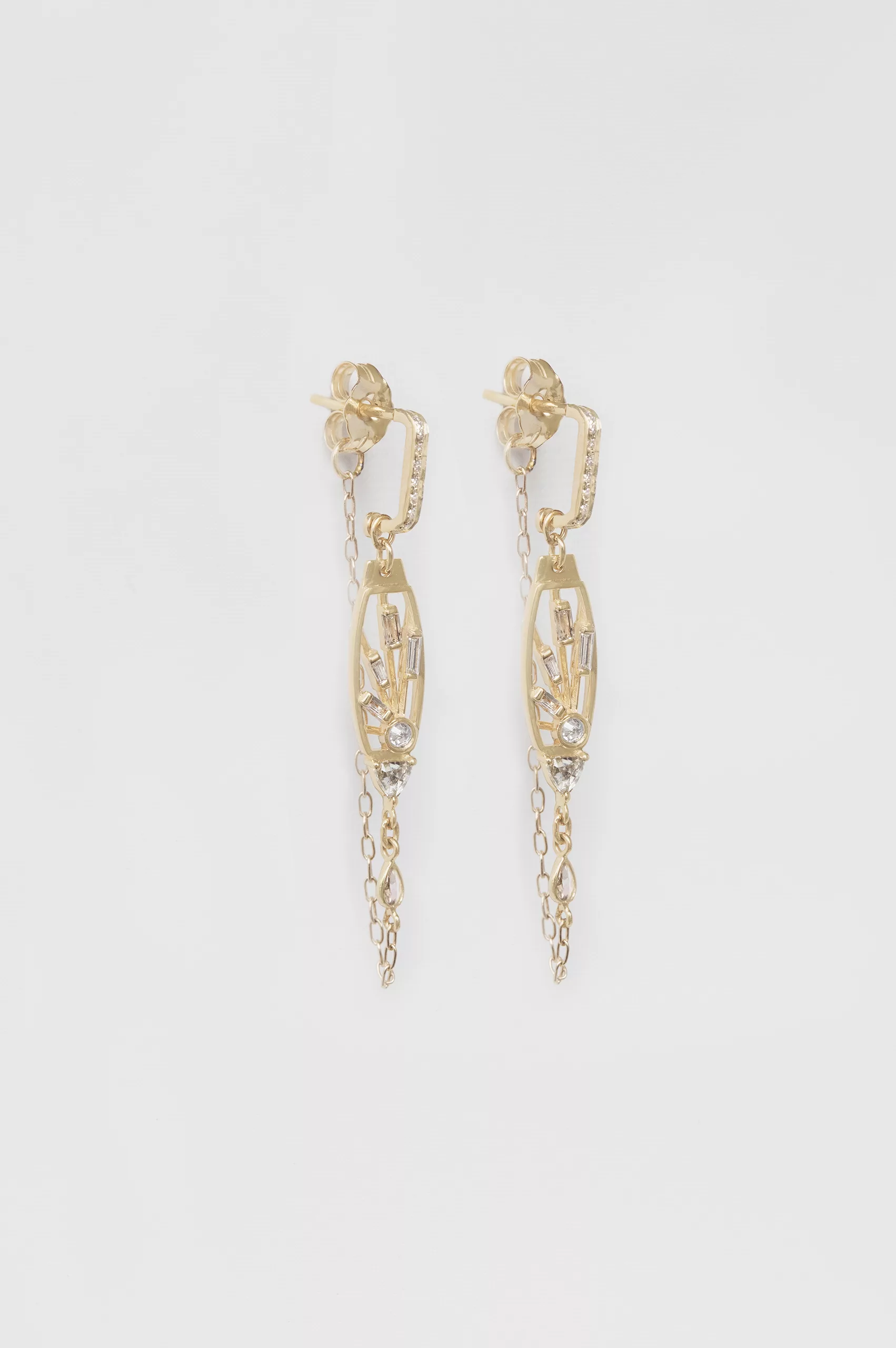Gold wire drop earrings set with pear-cut moonstones in bezel settings, each finished with a diamond accent and a delicate gold ball drop.