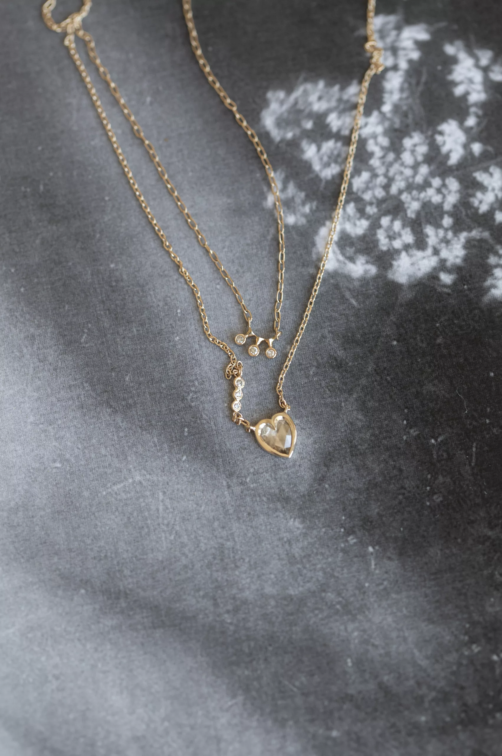 Gold necklace three diamonds bezel pendant delicate chain Céline Daoust with grey diamond heart and three diamonds chain neckalce