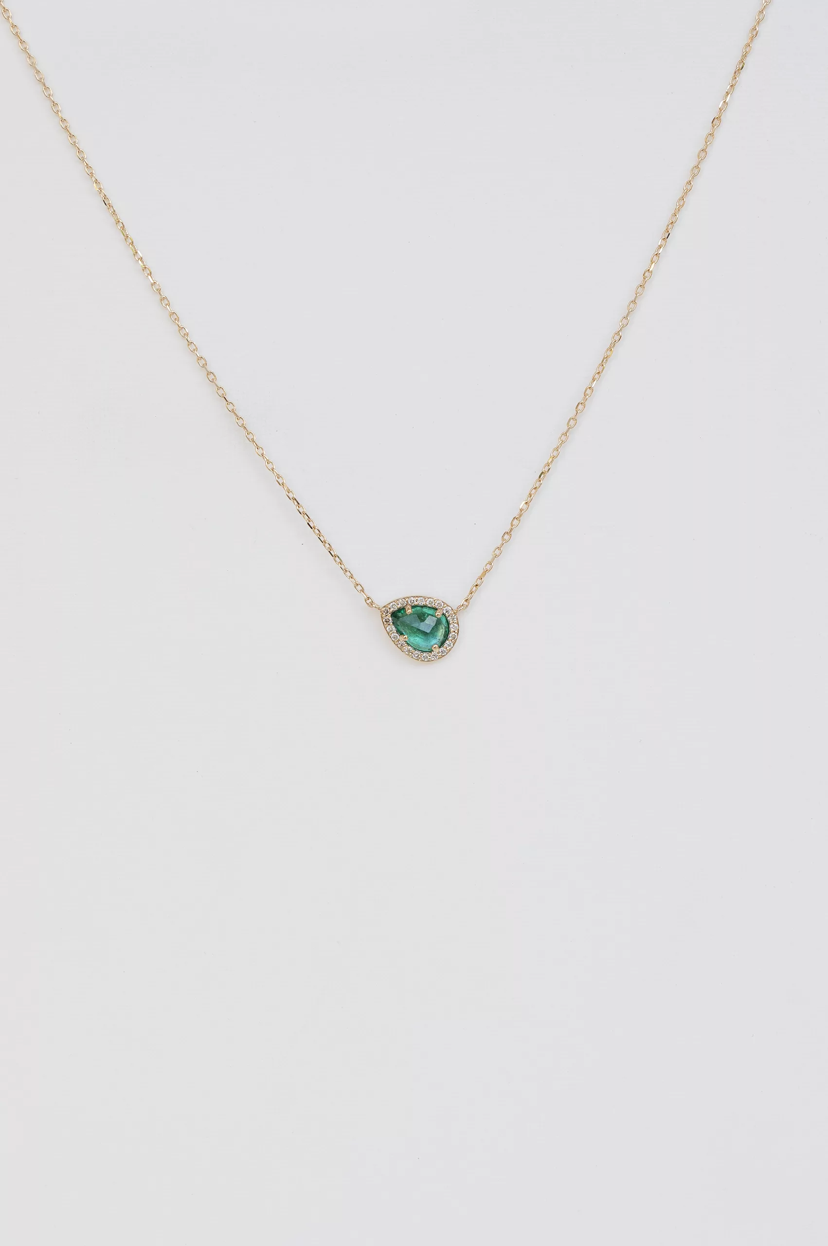 Yellow gold necklace oval emerald bezel pendant pavé diamond accent chain Celine Daoust