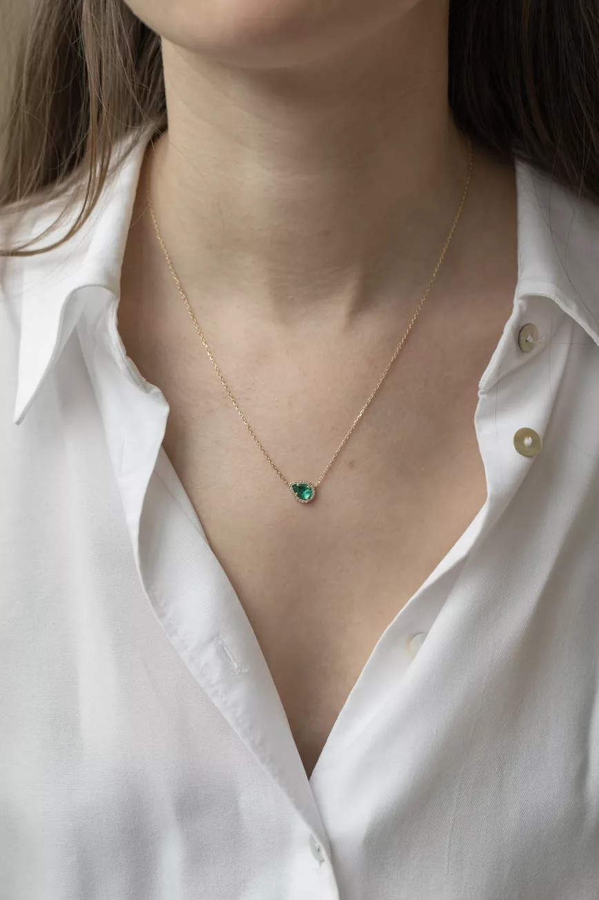 Yellow gold necklace oval emerald bezel pendant pavé diamond accent chain Celine Daoust